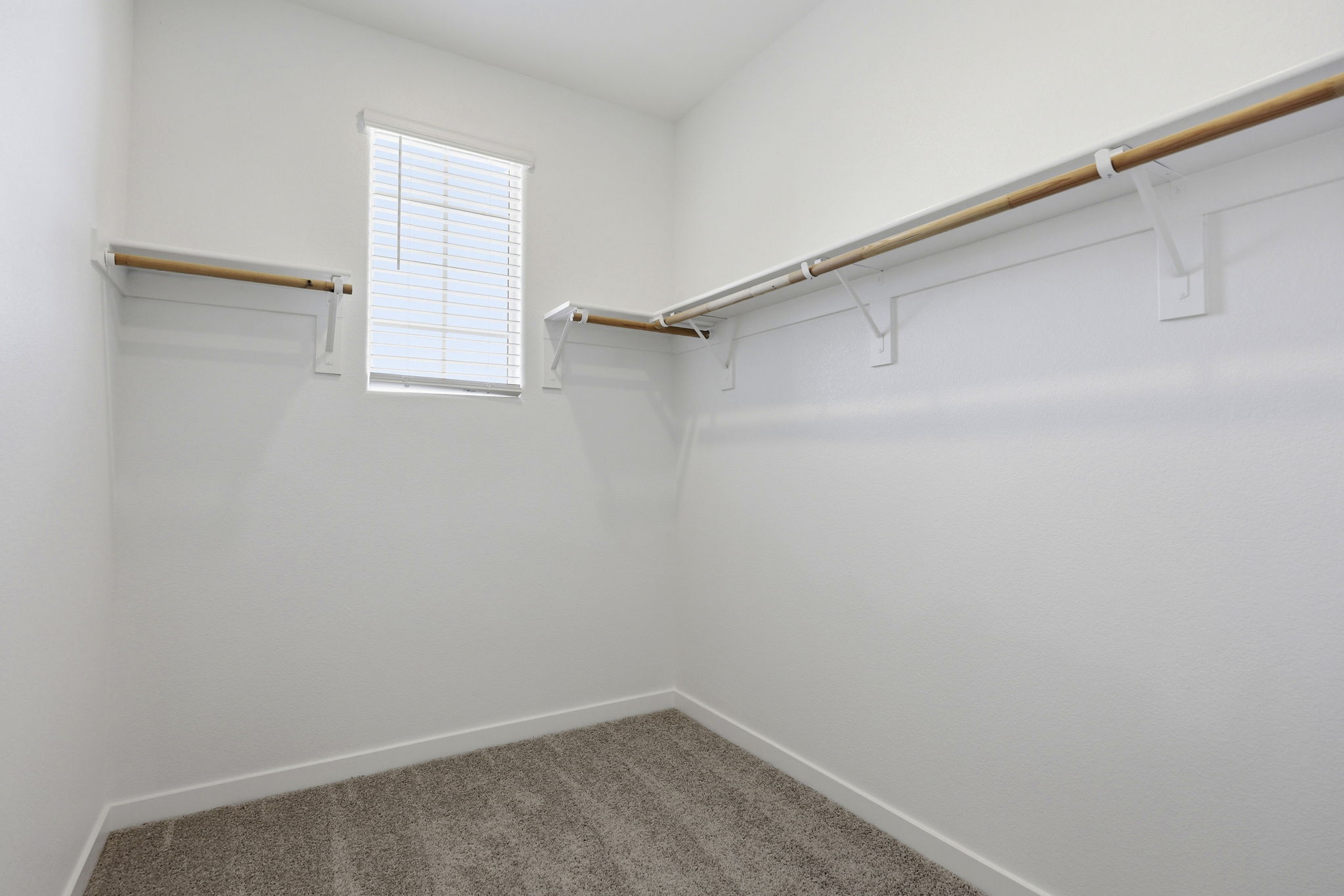 A white room with a window.
