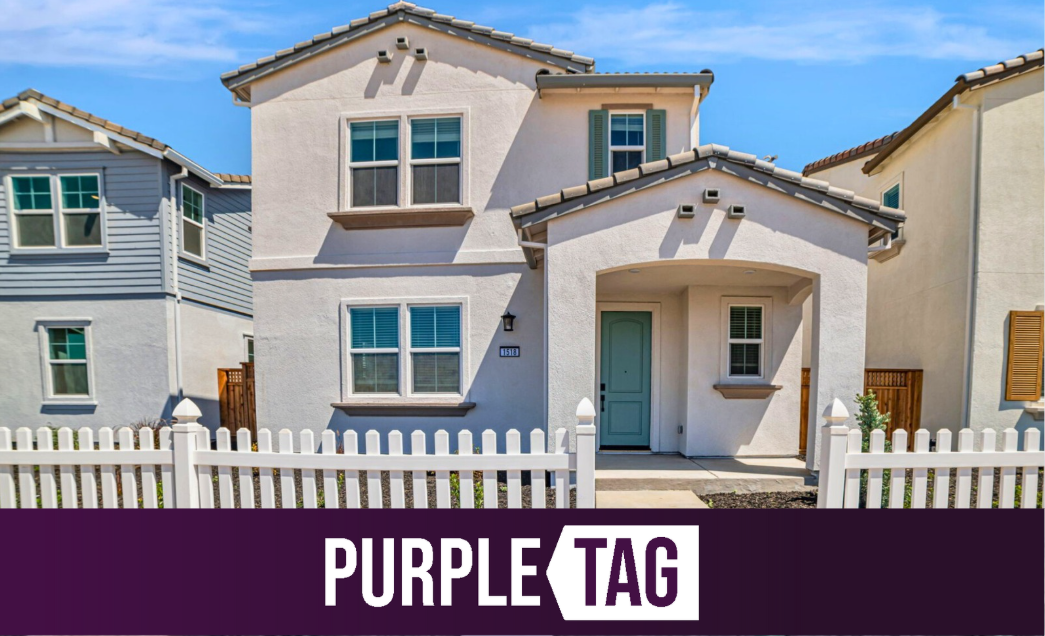 A house with a white picket fence.