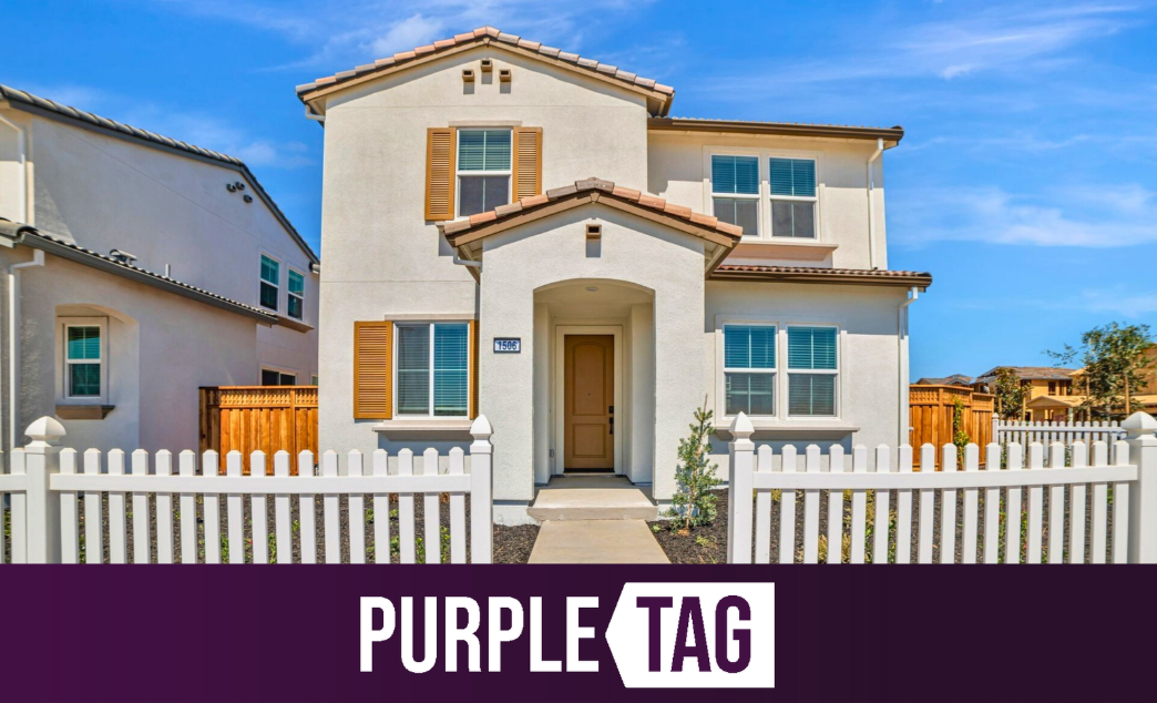 A house with a white picket fence.
