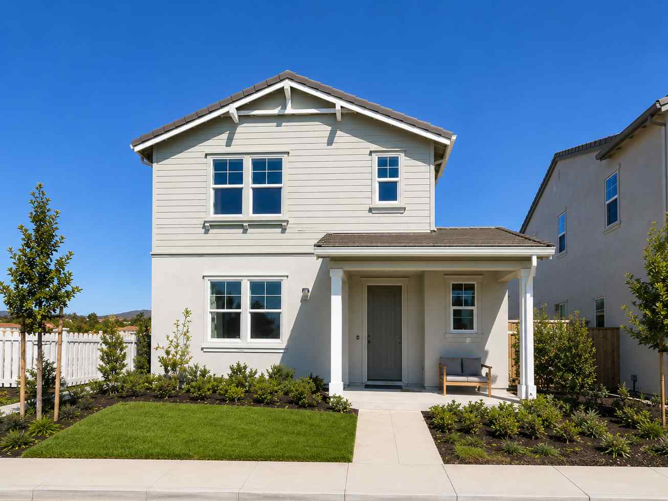 A white house with a driveway.