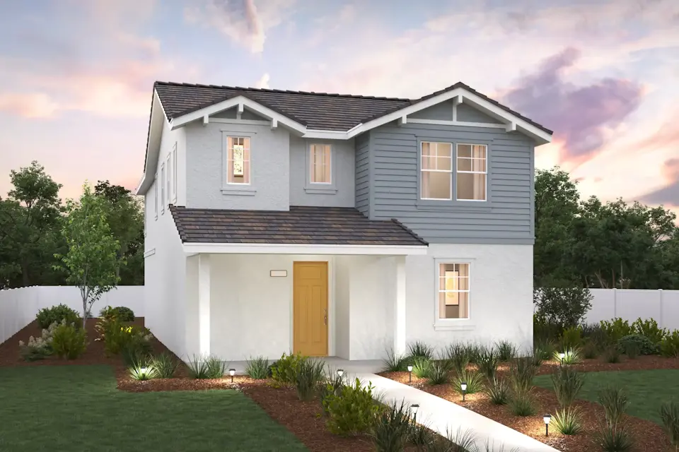 A white house with a driveway.