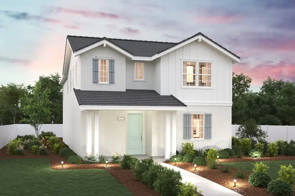 A white house with a driveway.