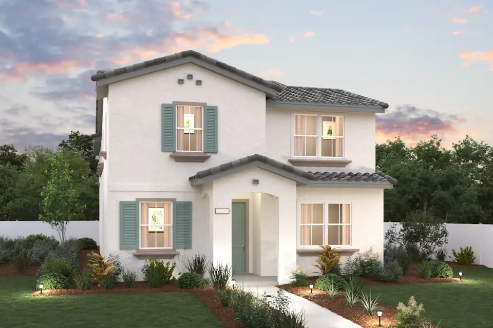 A white house with green shutters.