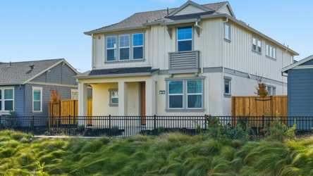 A house with a fence around it.
