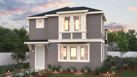 A house with a lawn and trees.