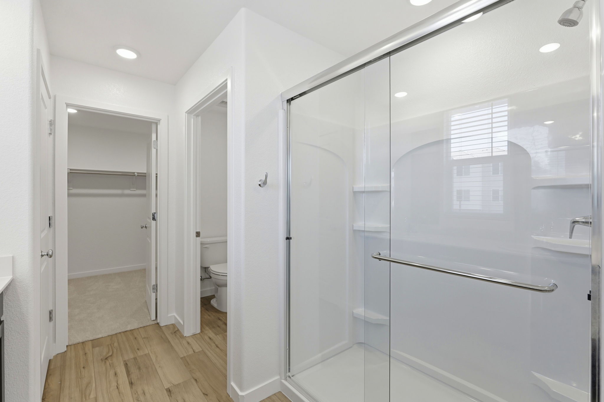 A bathroom with a glass shower.