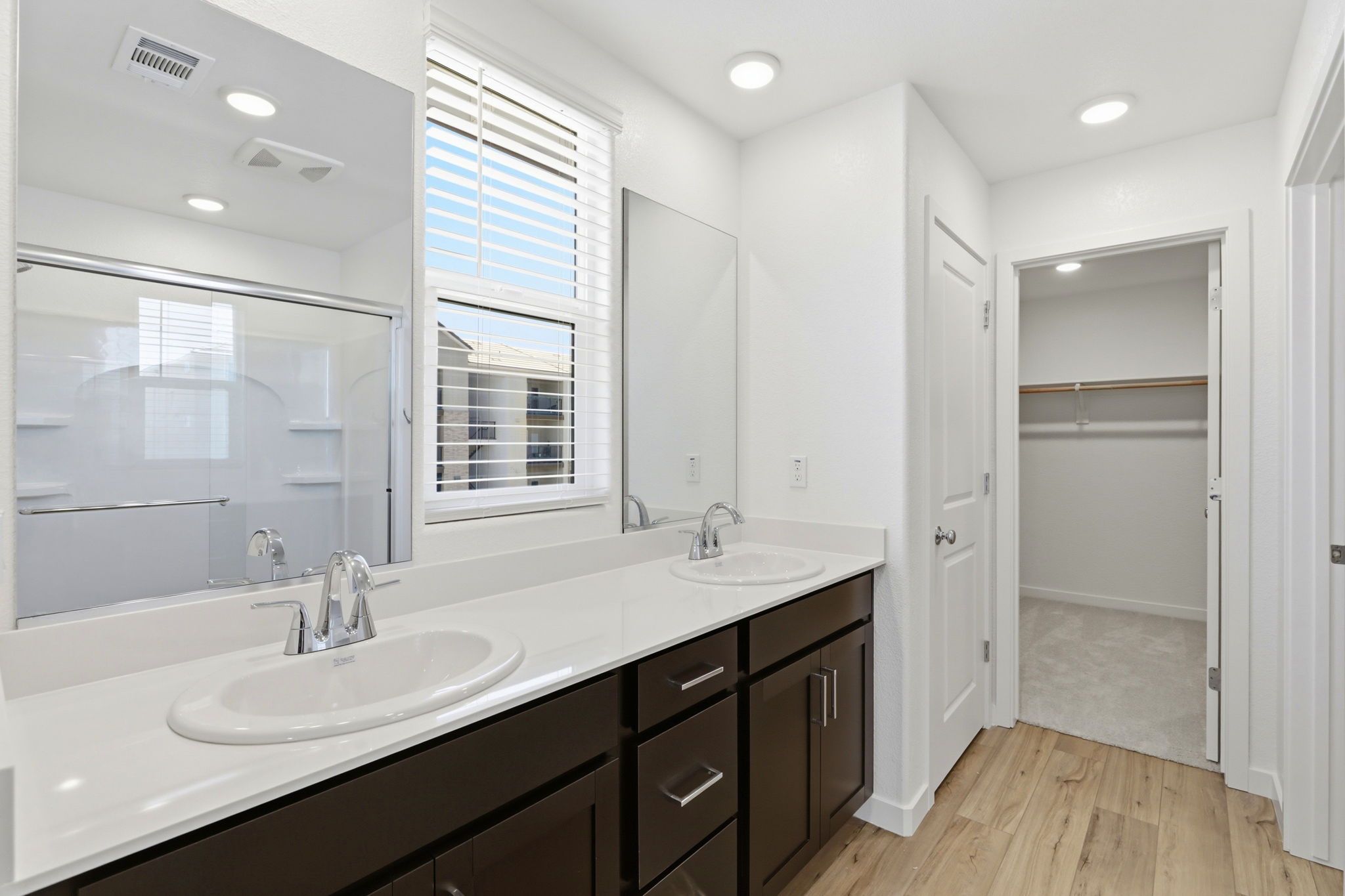 A bathroom with a large mirror.