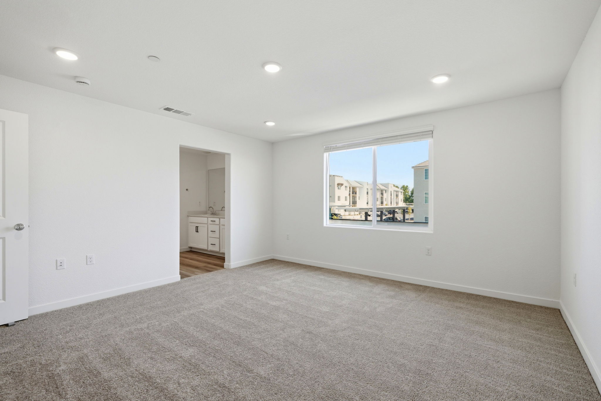 A room with a window and a door.