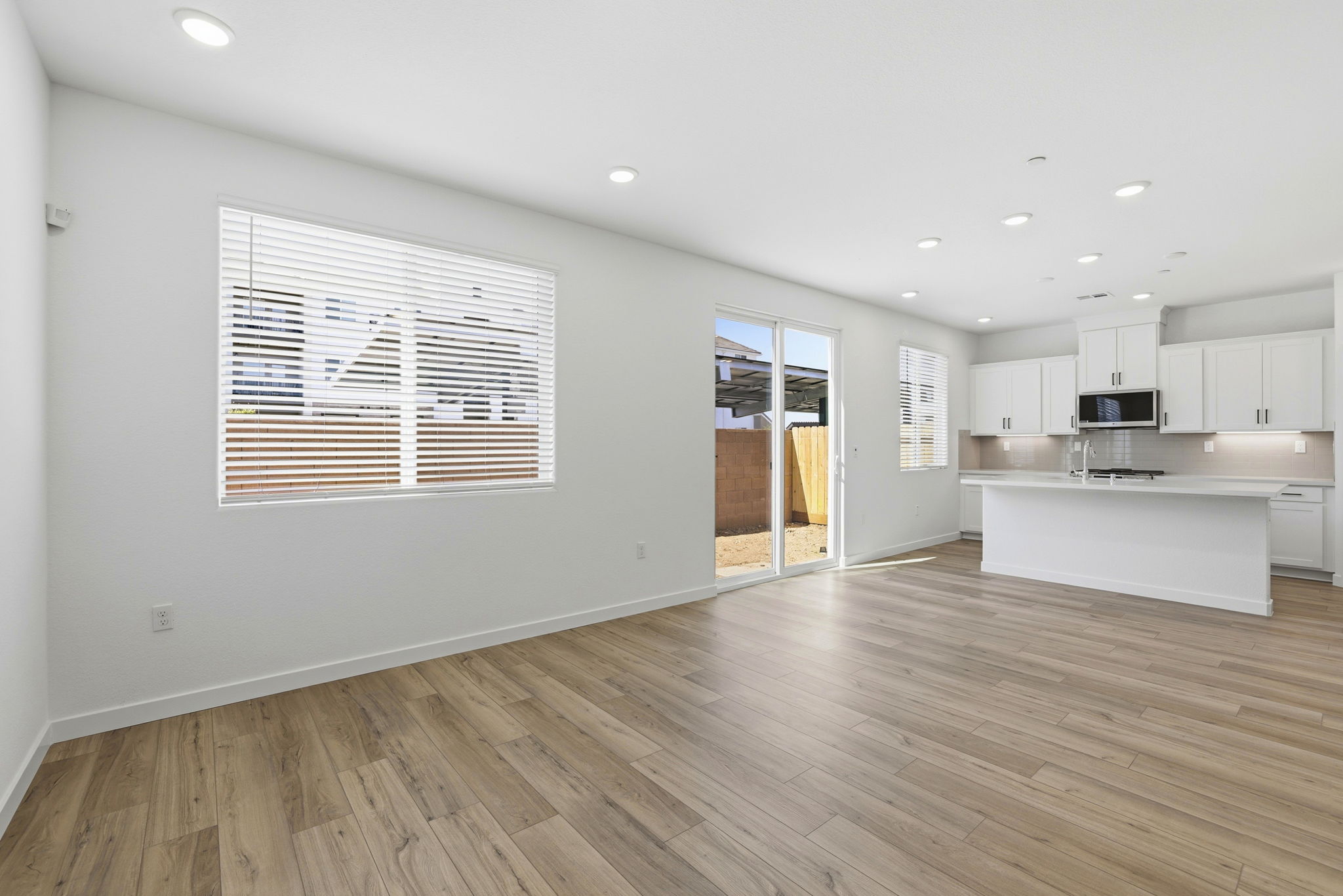 A kitchen with white walls.