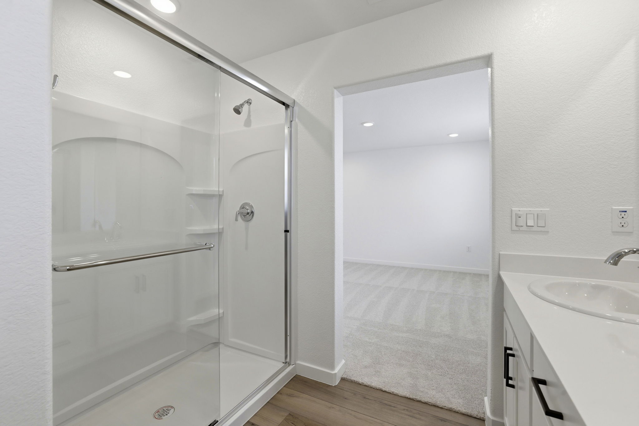 A bathroom with a glass shower.