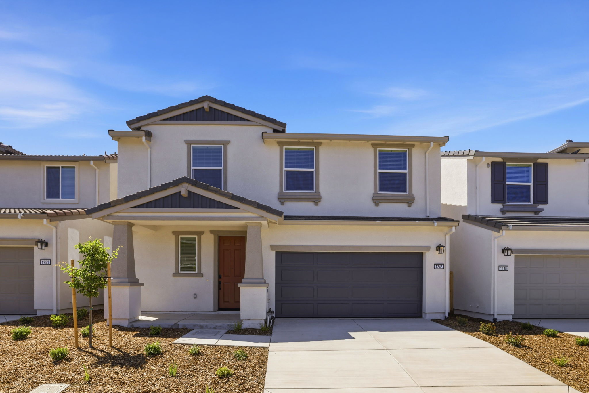 A house with garages and a driveway.