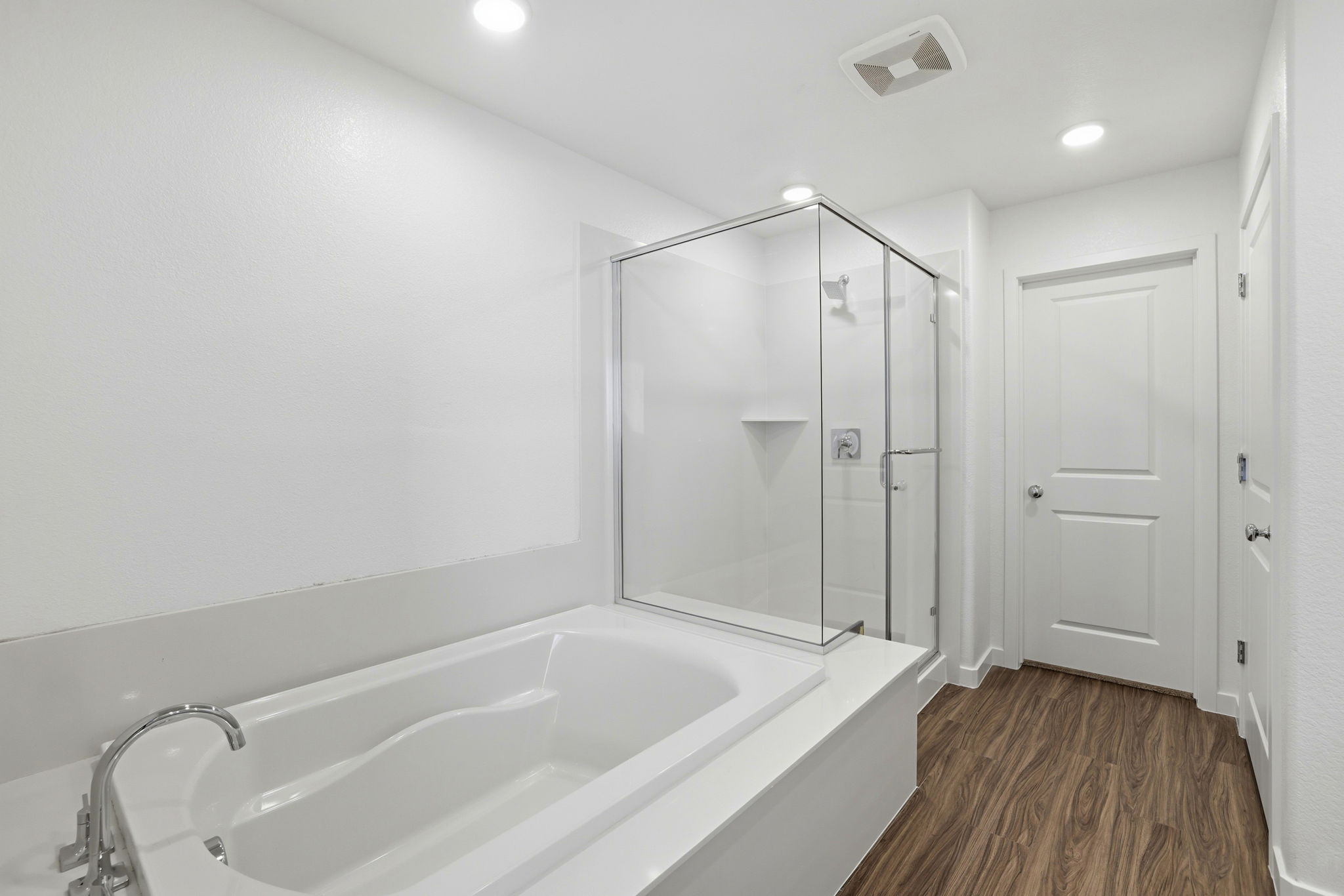 A bathroom with a glass shower.
