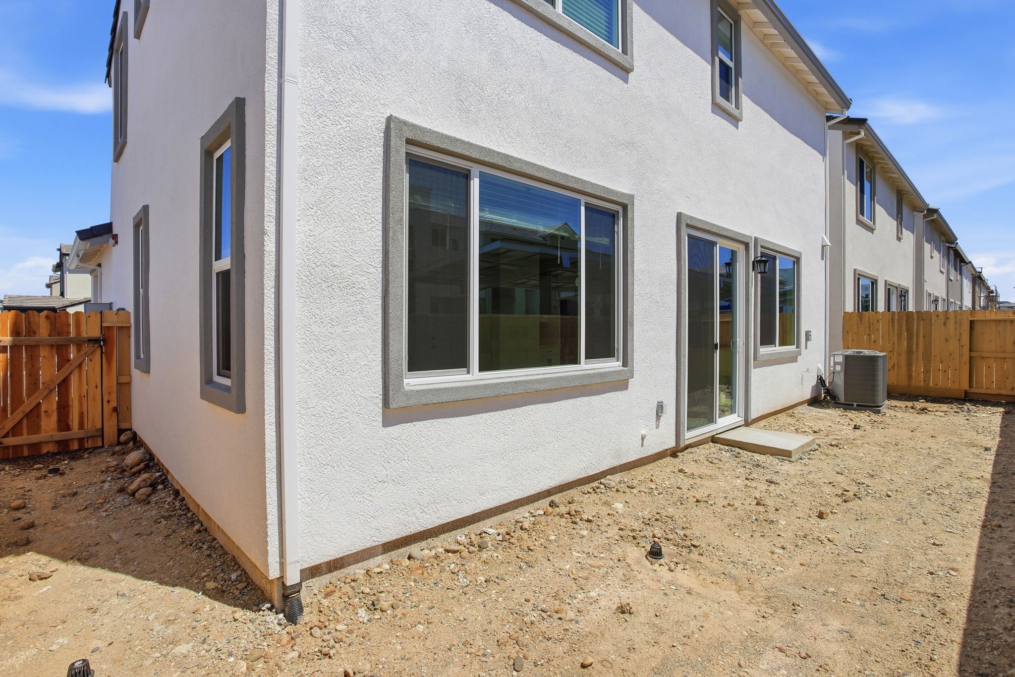A white building with a fence.