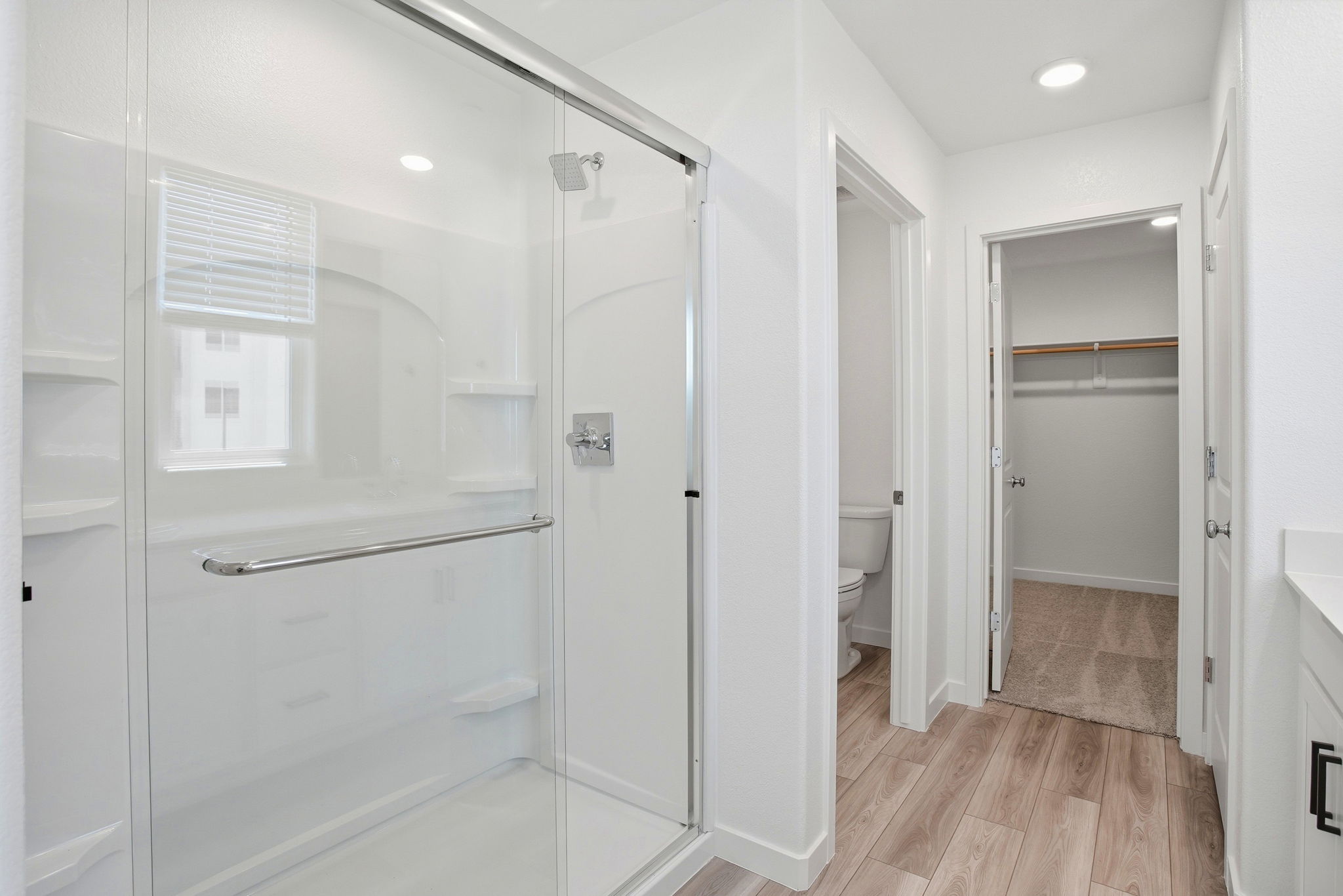 A bathroom with white doors.