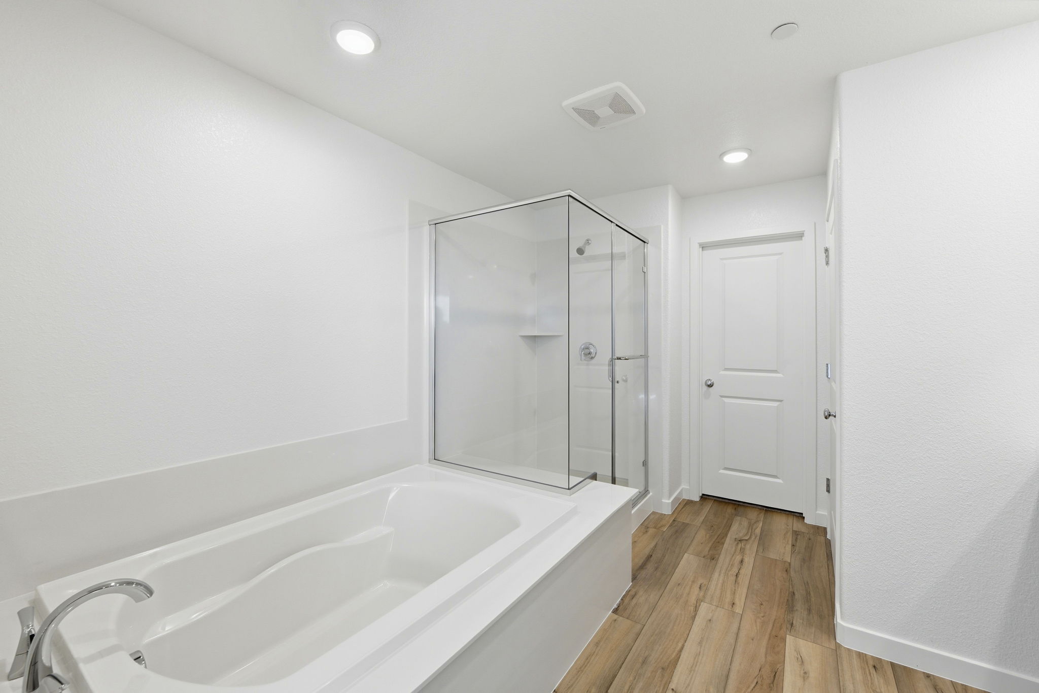 A bathroom with a glass shower.