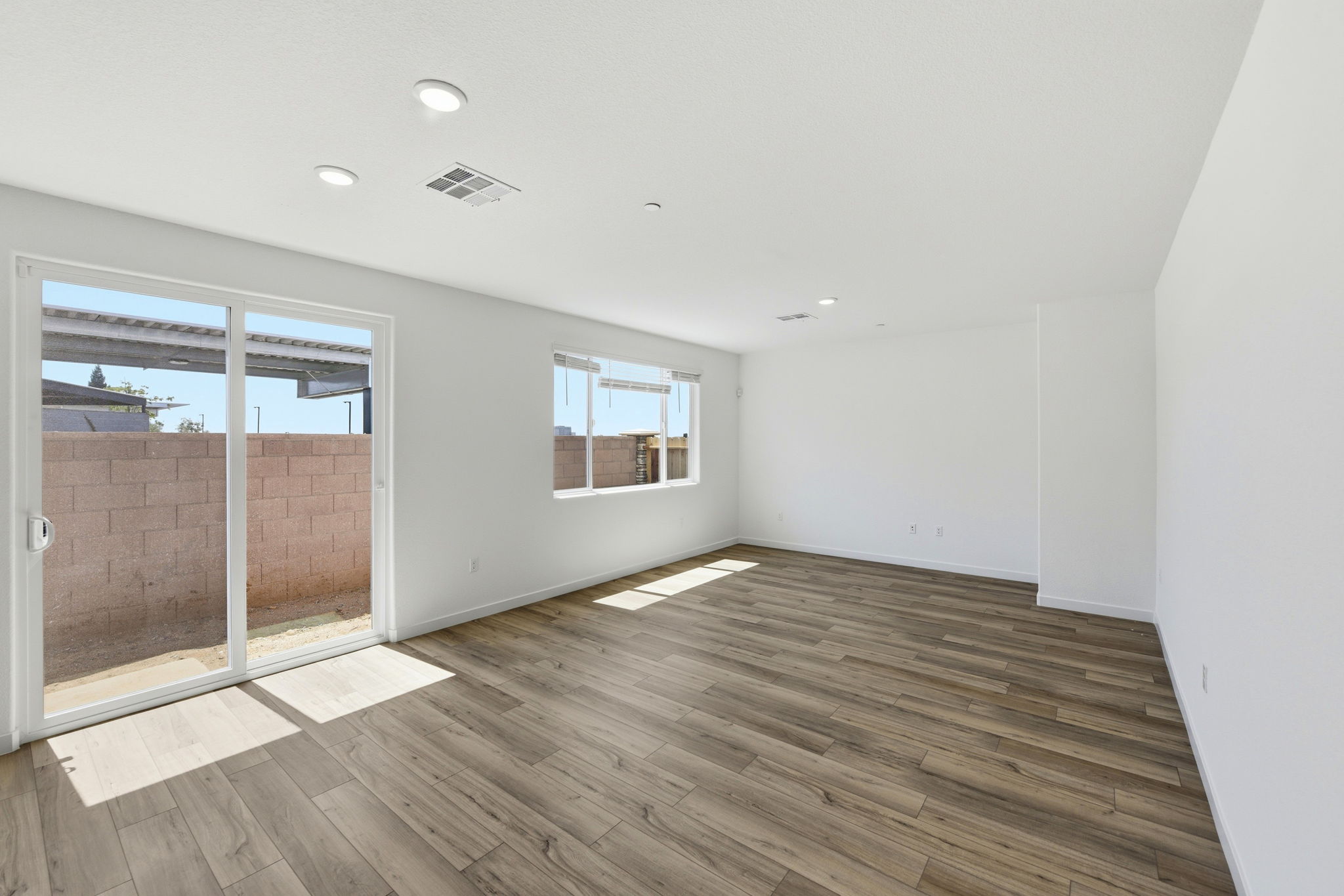 A room with a wood floor and a wood floor.