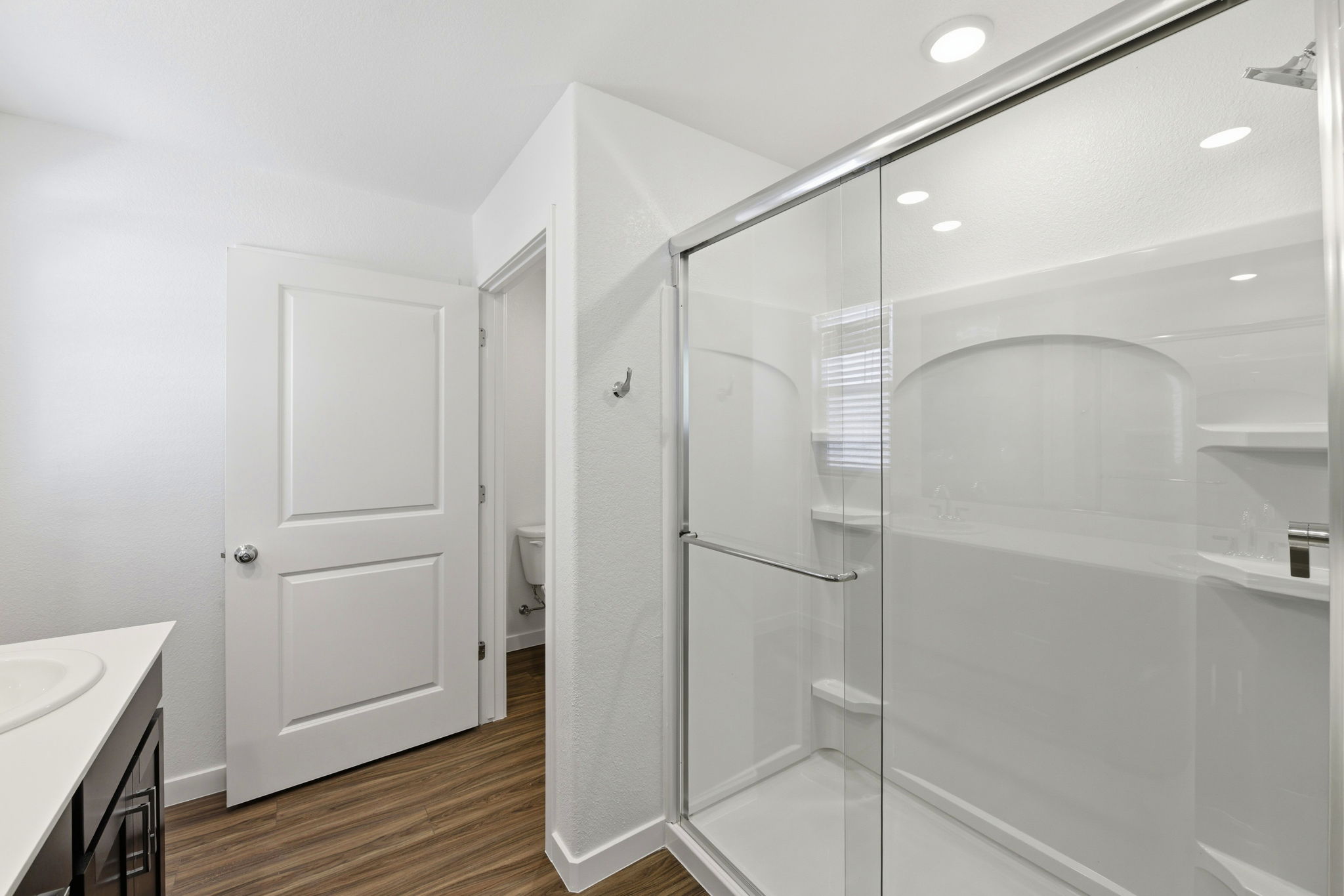 A bathroom with a glass shower.