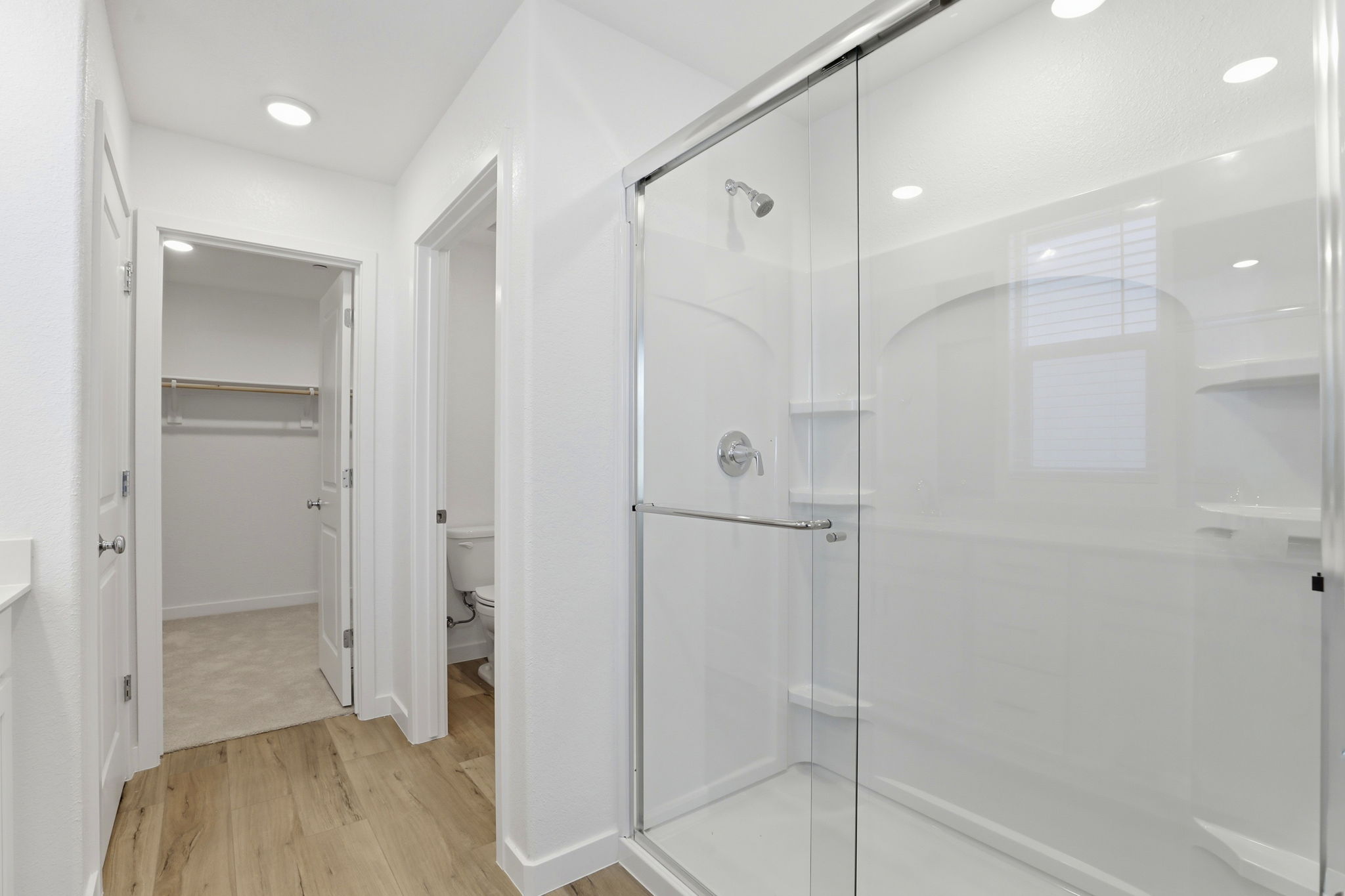 A bathroom with a glass shower.
