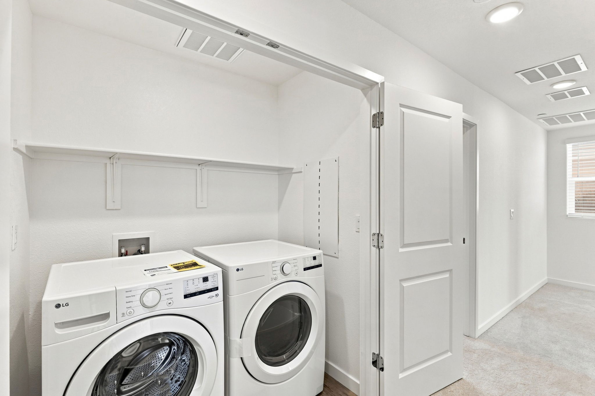 A laundry room with a washer and dryer.