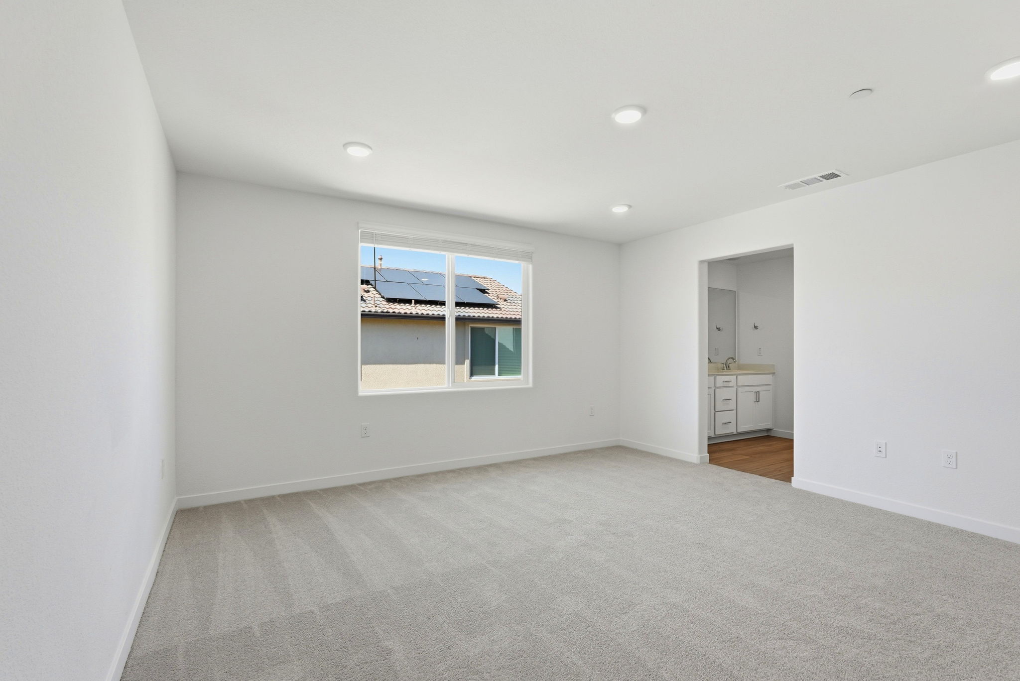 A room with a window and a door.