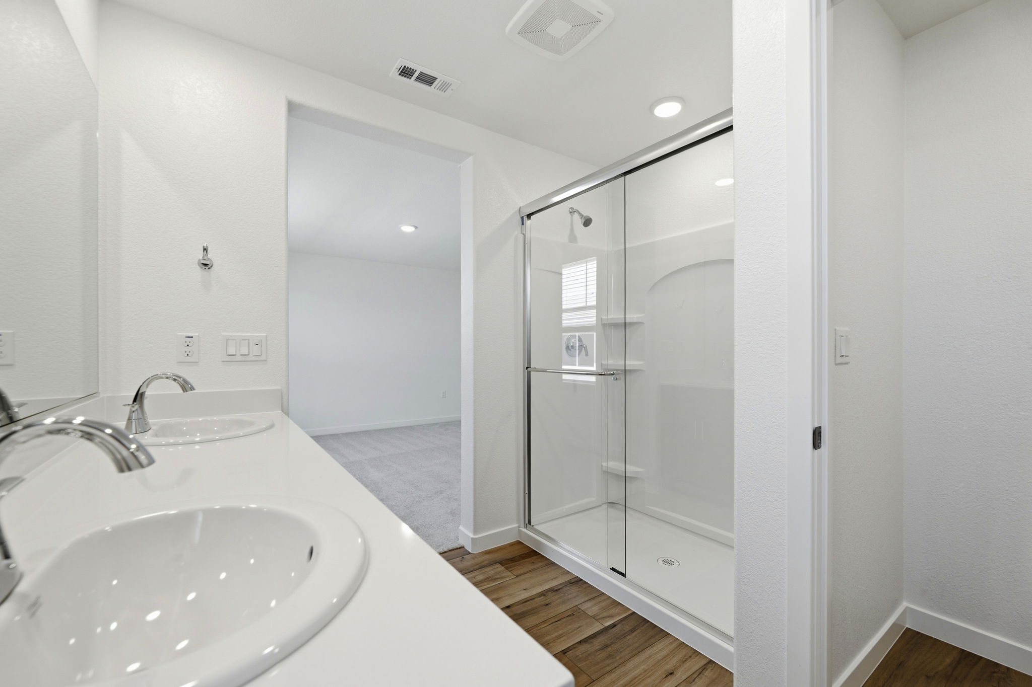 A bathroom with a glass shower.