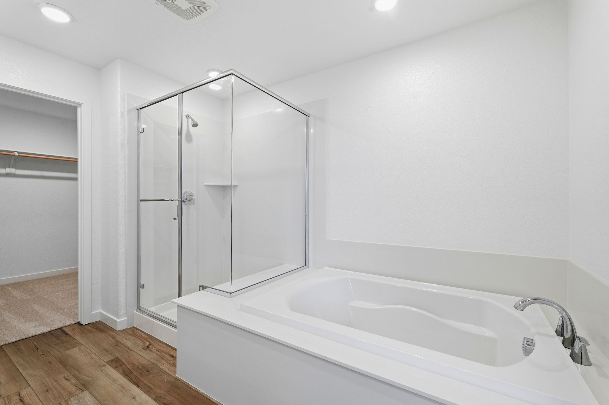 A bathroom with a glass shower.