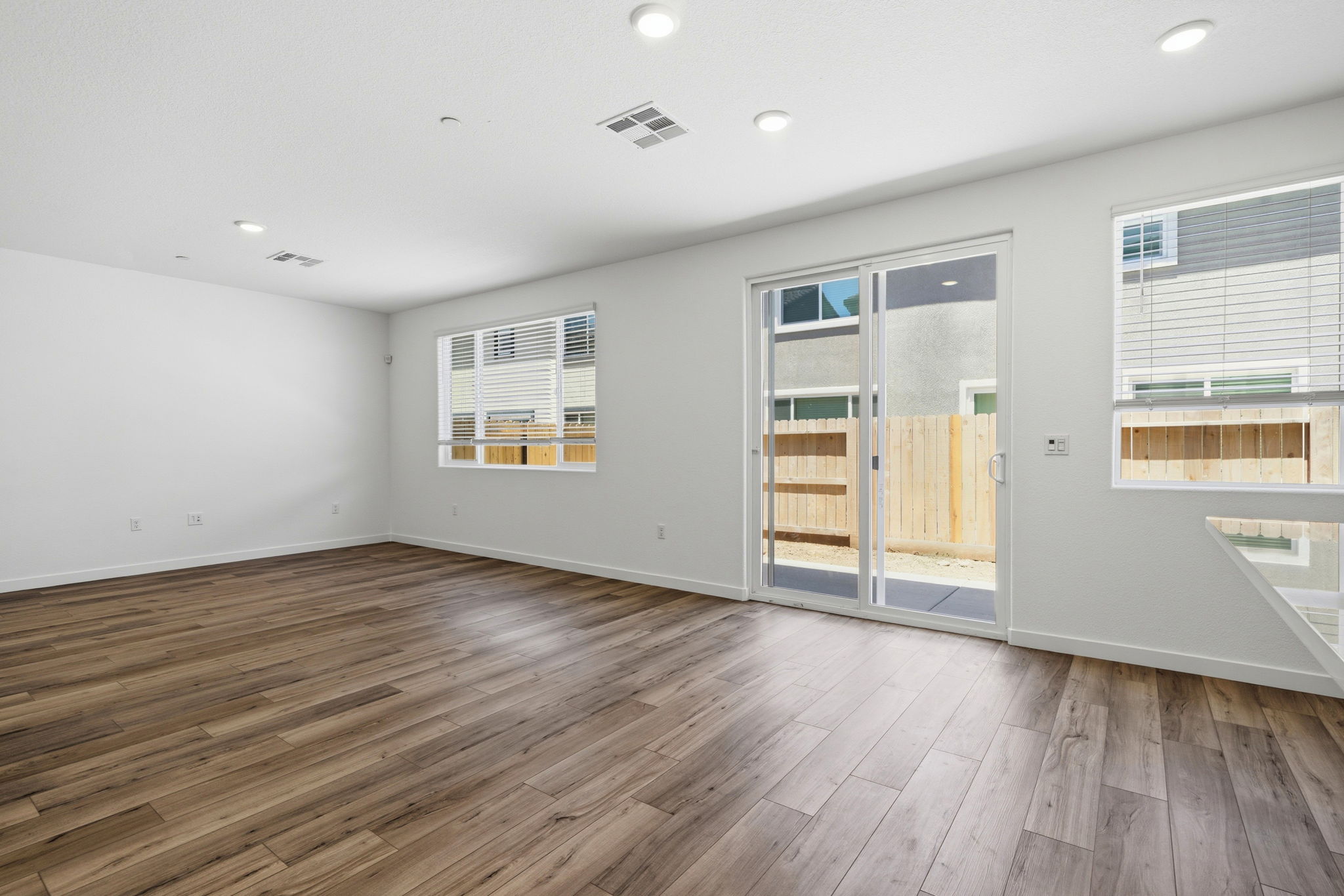 A room with a wood floor and a wood floor.