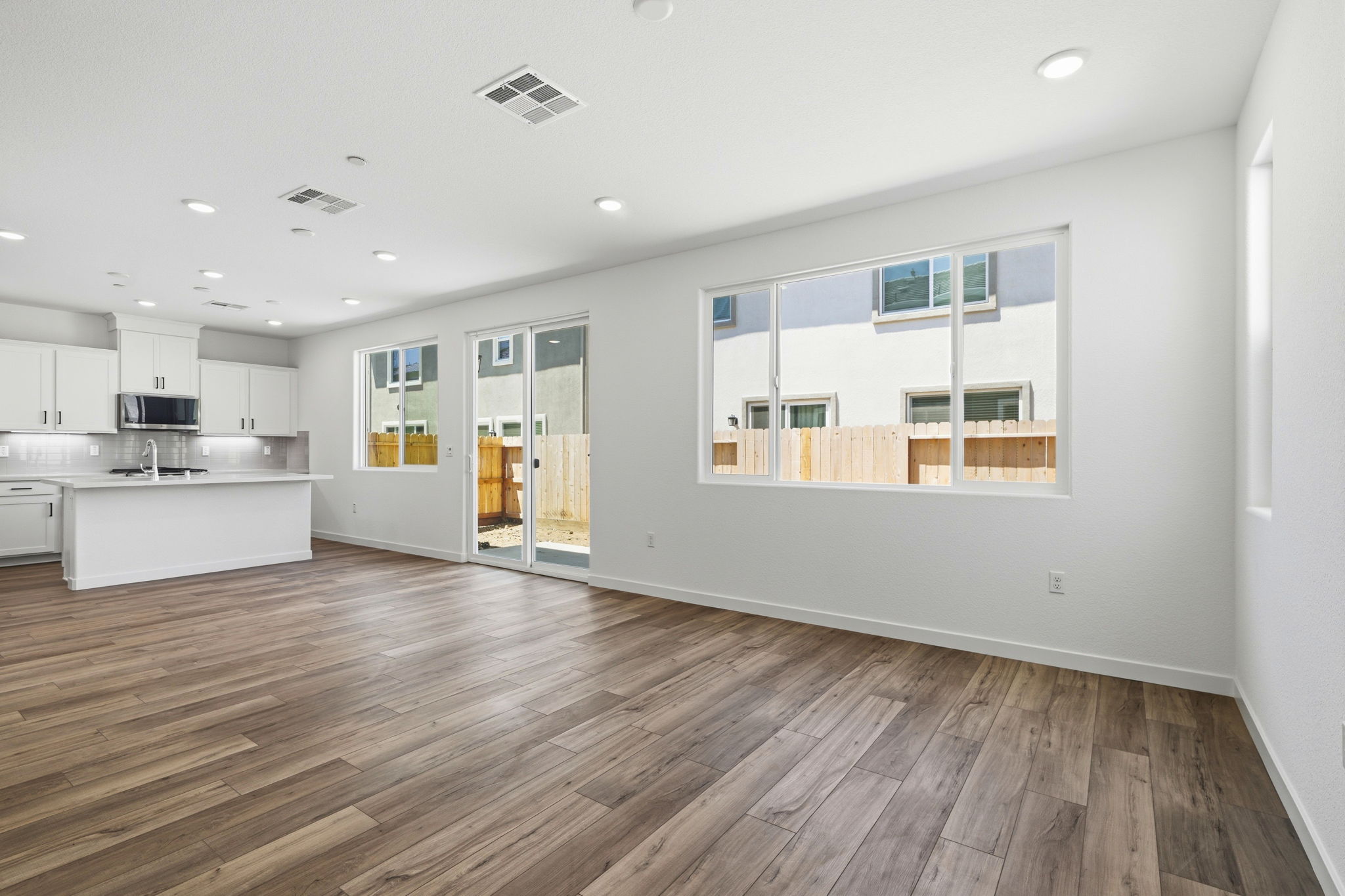 A kitchen with white walls.