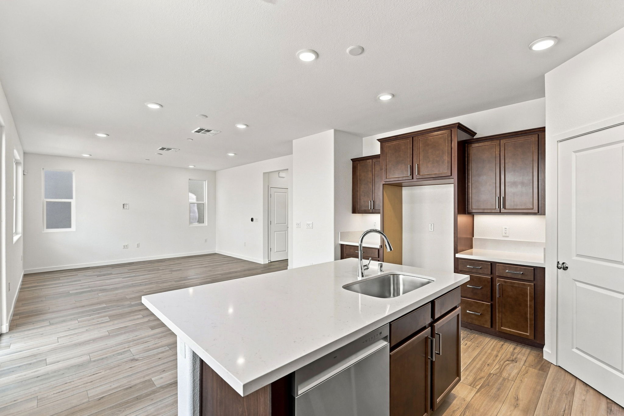 A kitchen with wooden cabinets.