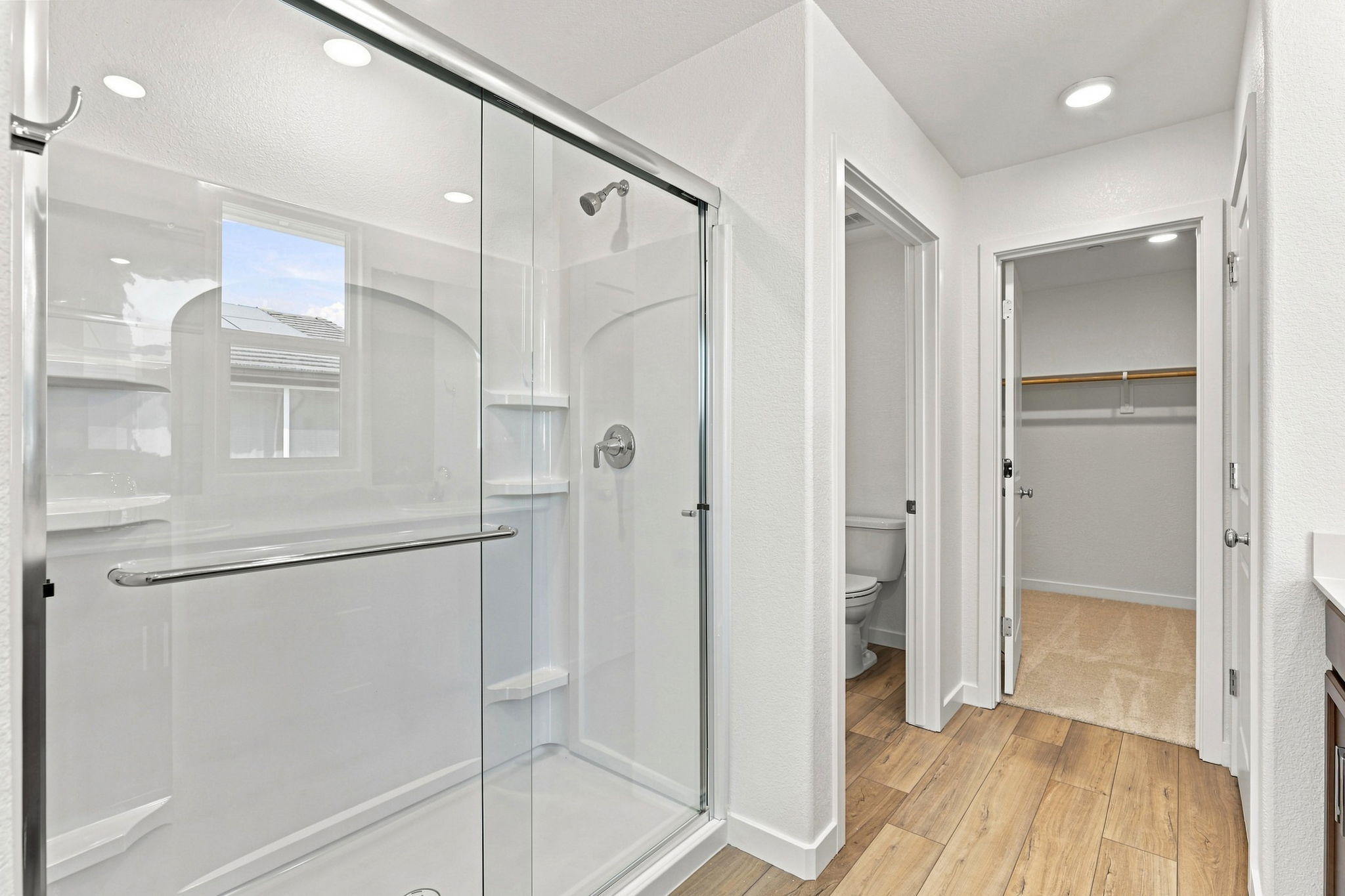 A bathroom with a glass shower.