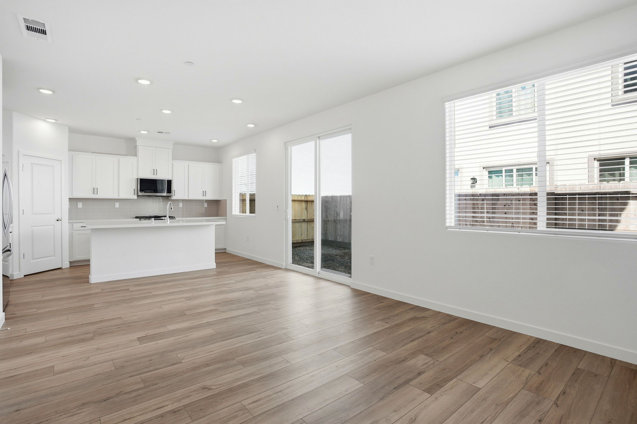 A large kitchen with white cabinets.