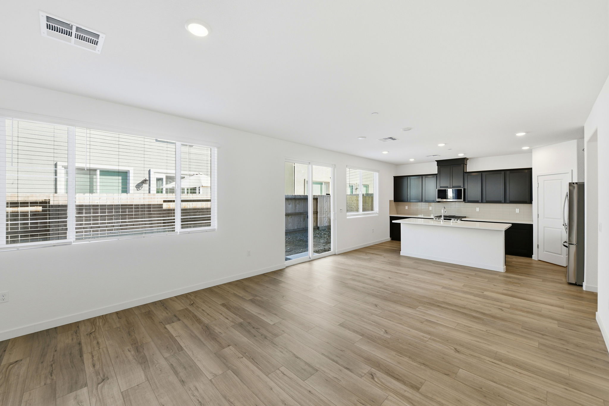 A kitchen with white walls.