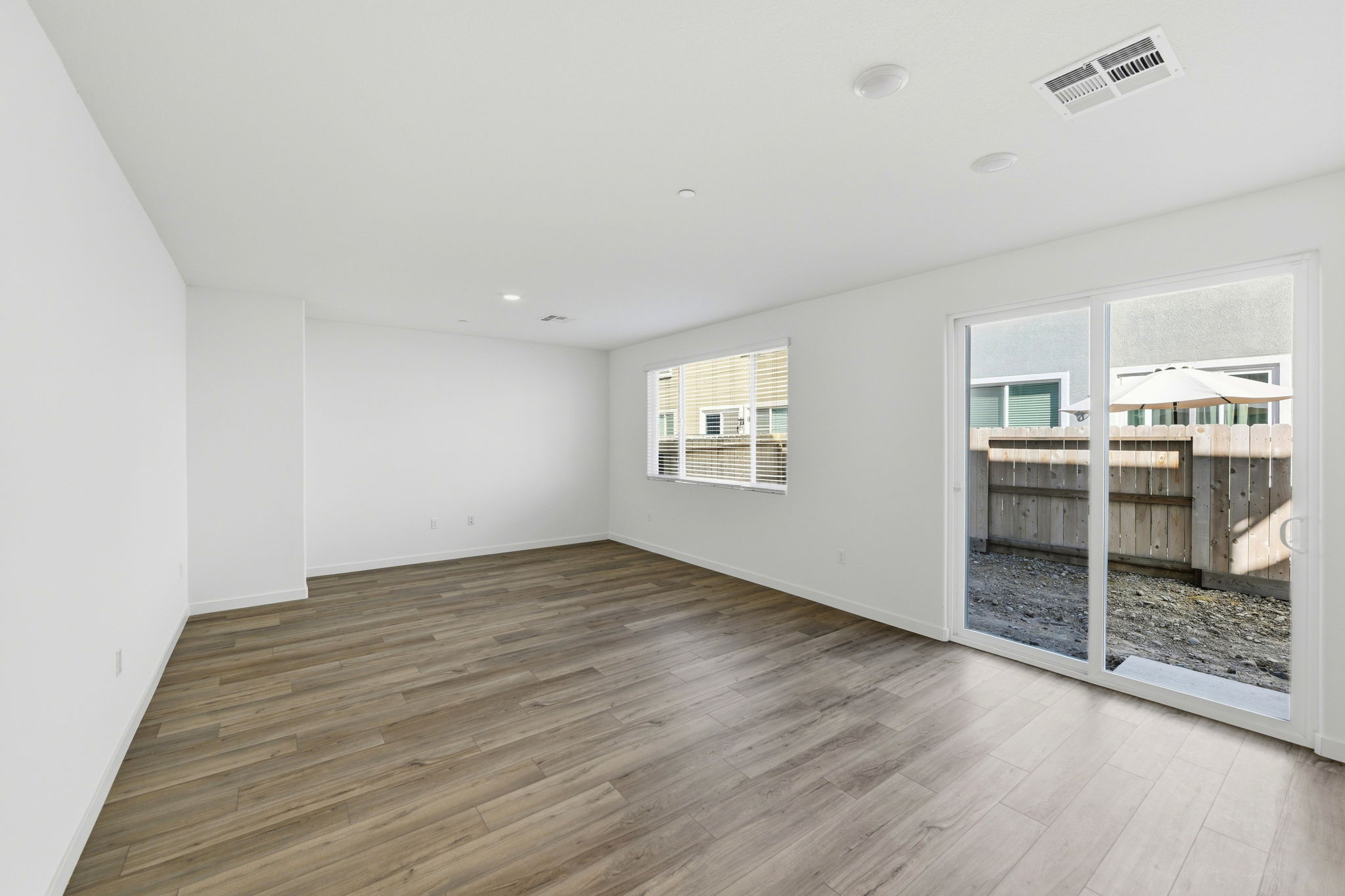 A room with a wood floor and a wood floor.