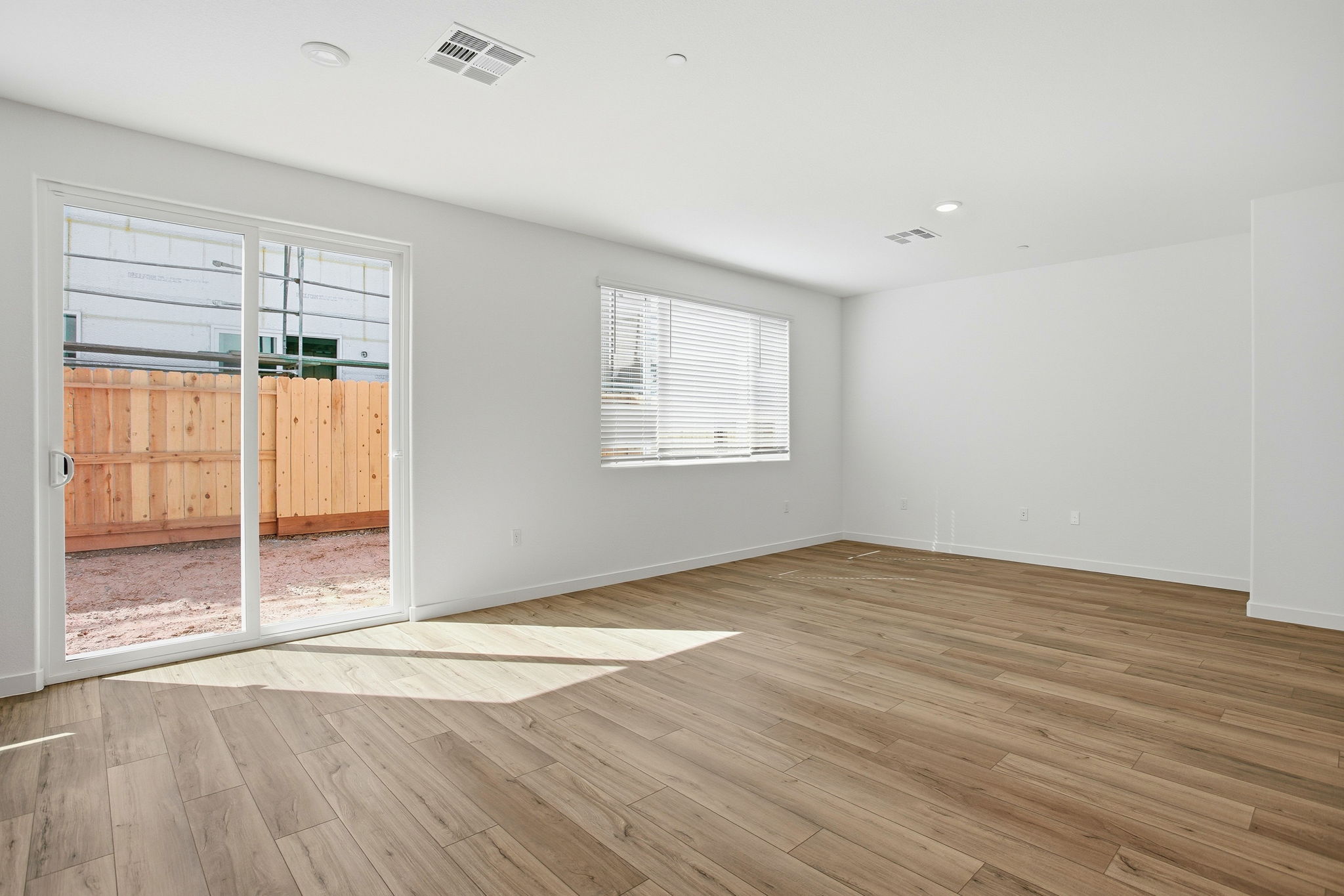 A room with a wood floor and a wood floor.