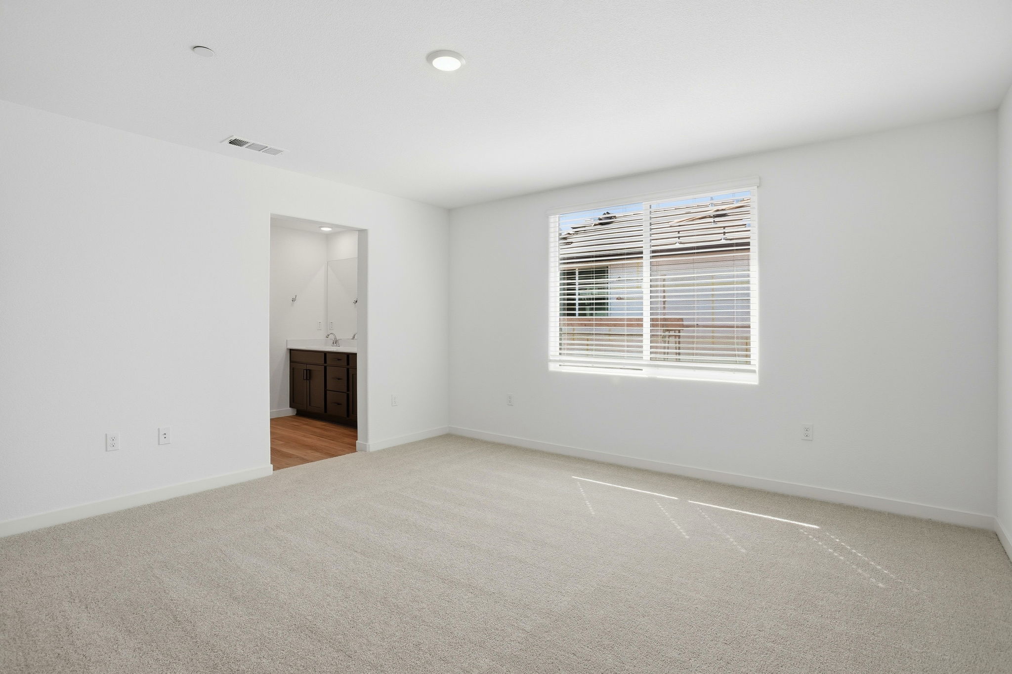 A room with a window and a door.