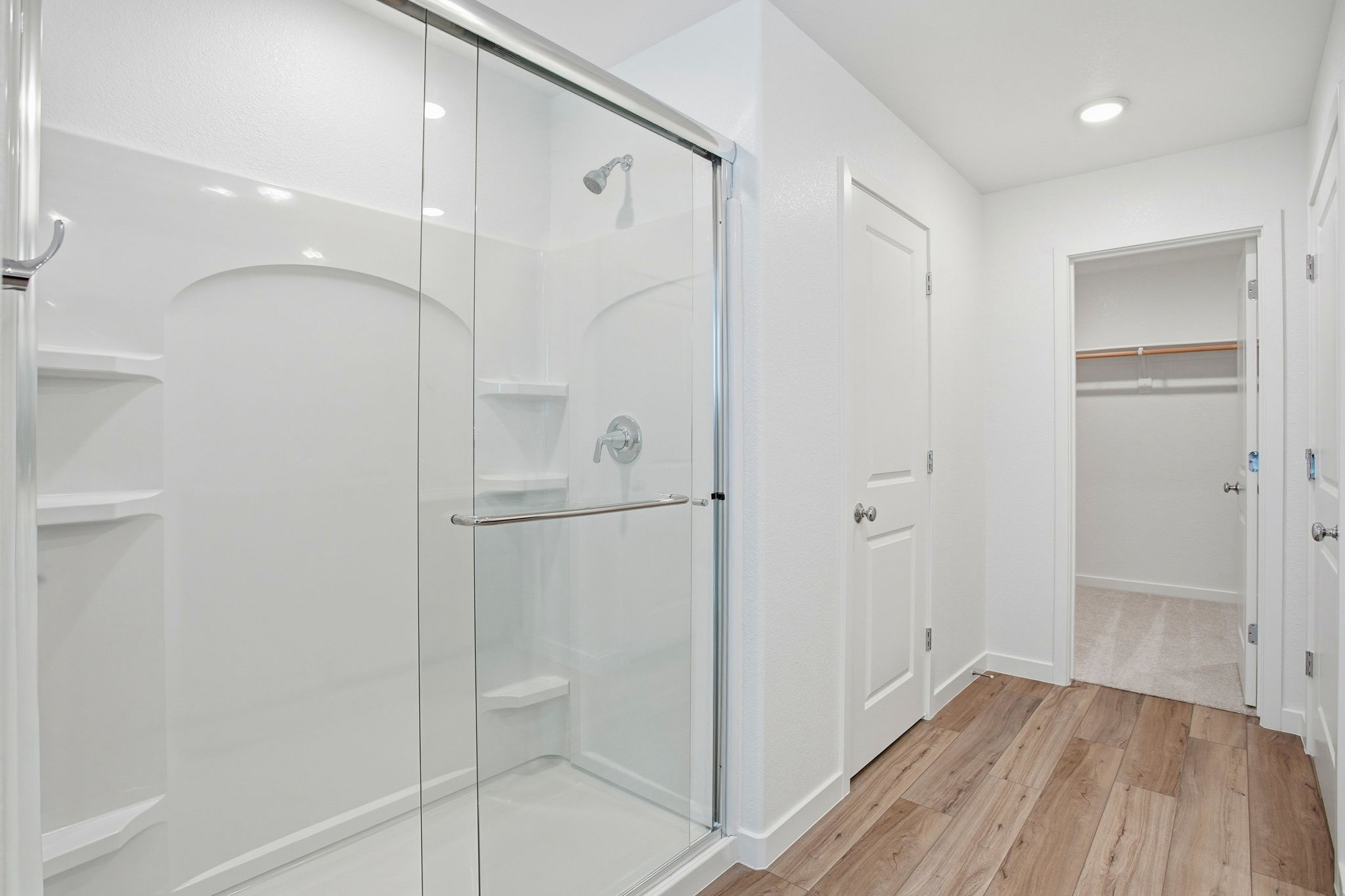 A bathroom with a glass shower.