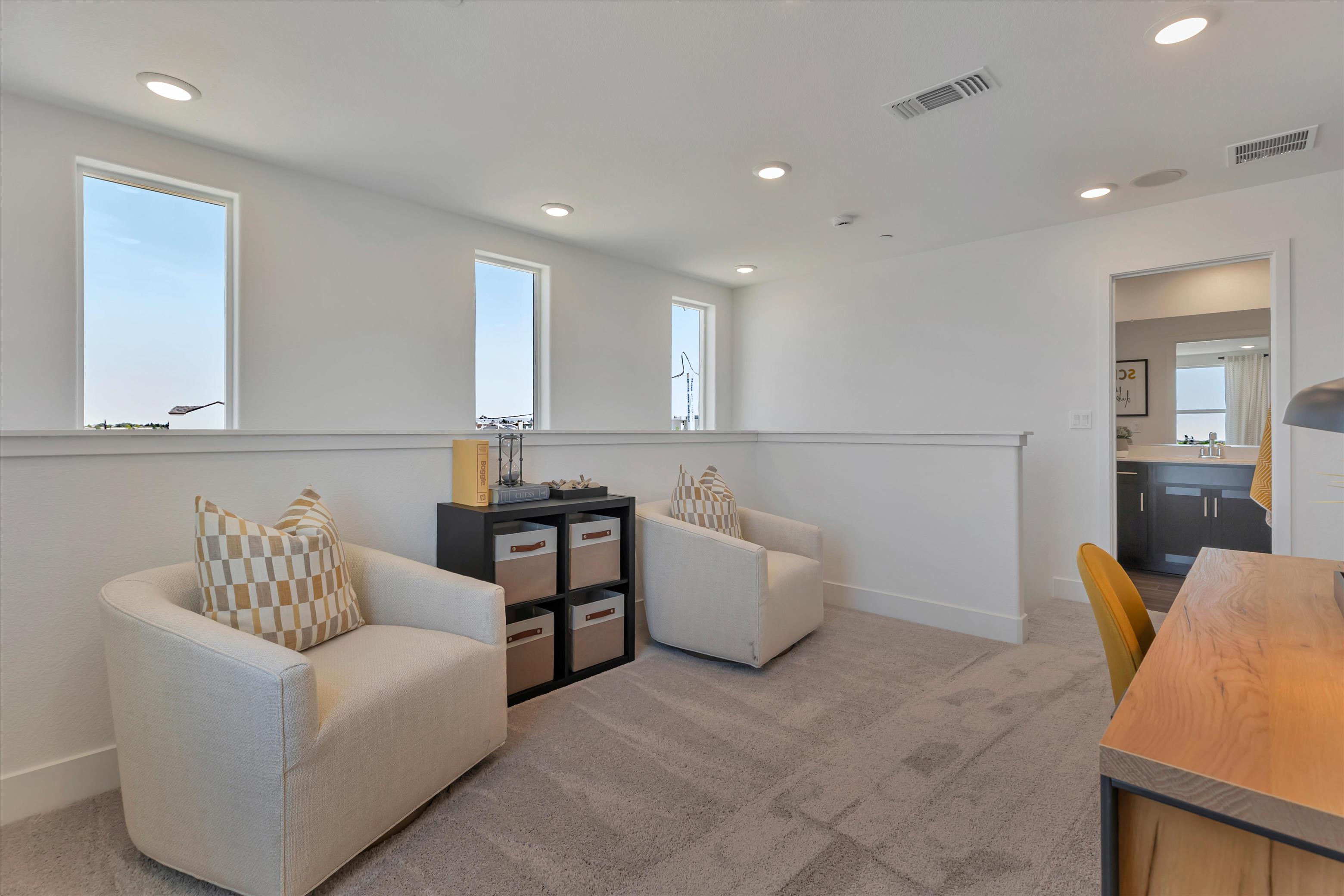 A living room with a couch and a table.