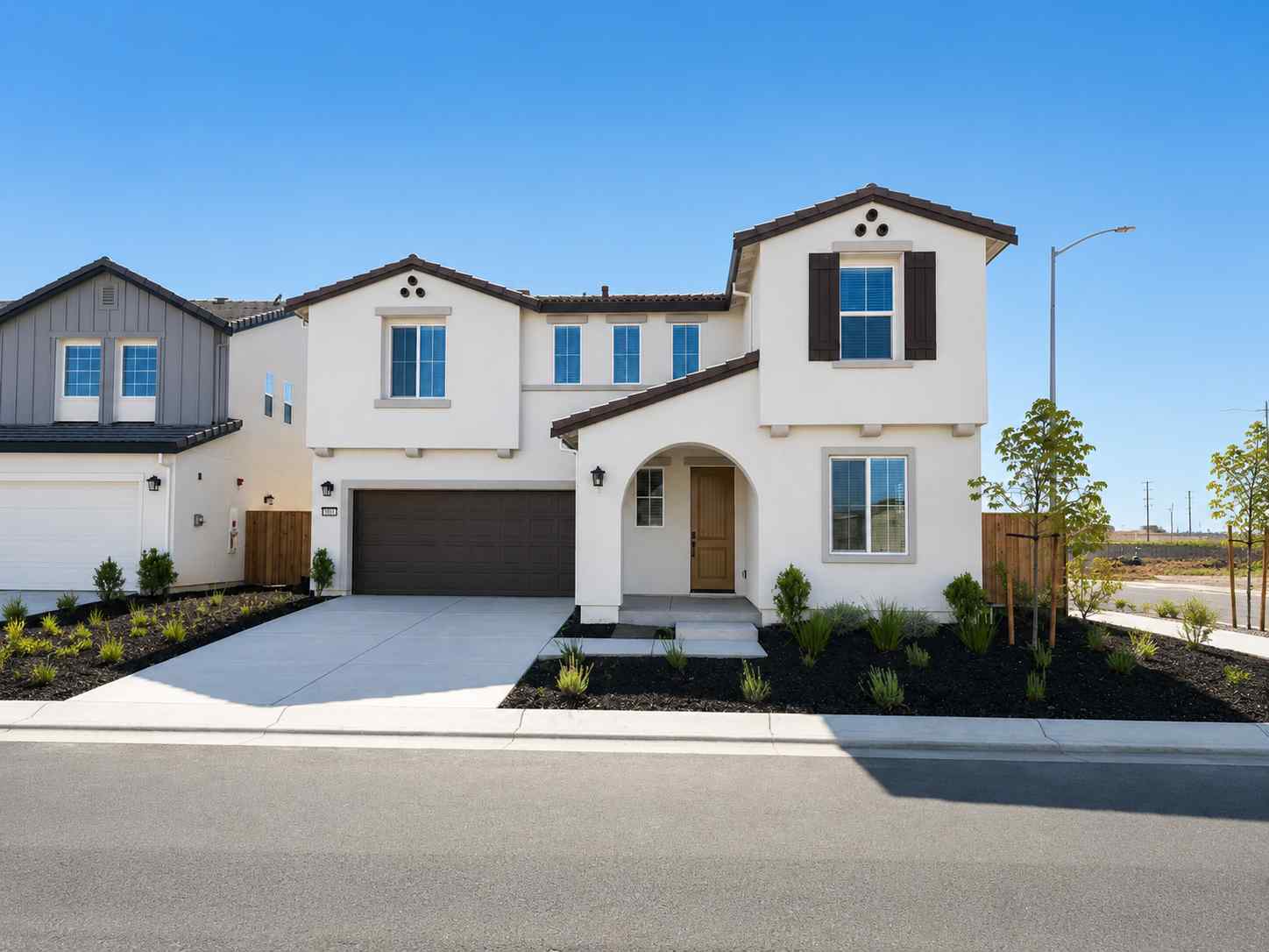 A white house with a driveway.