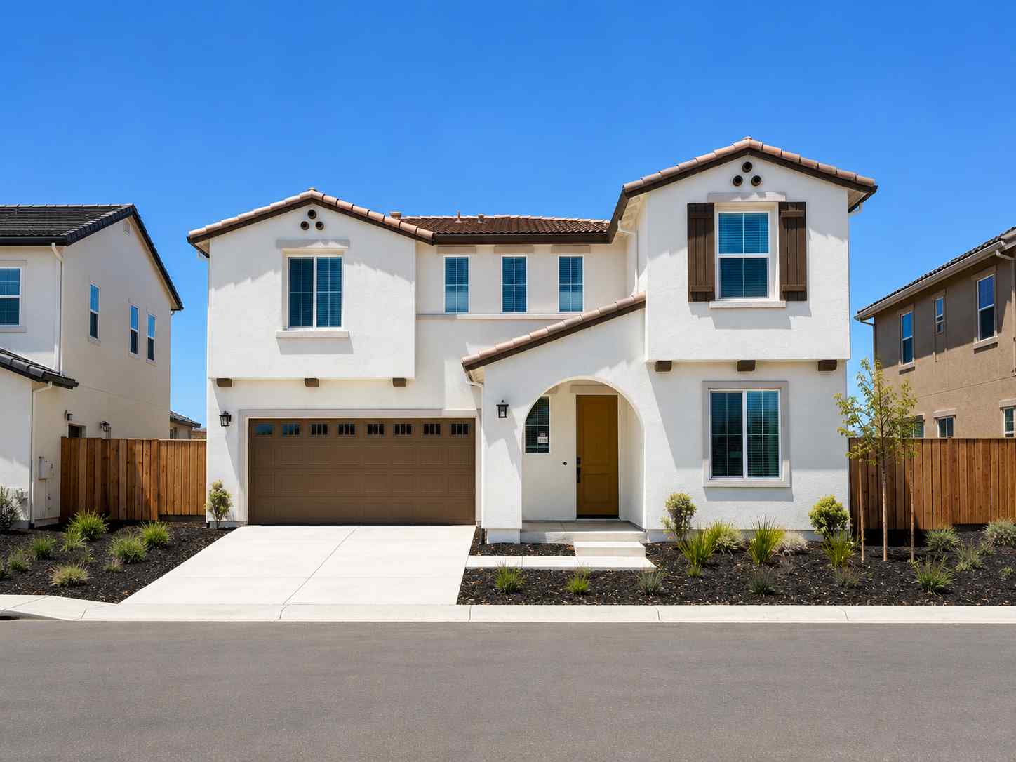 A white house with a driveway.