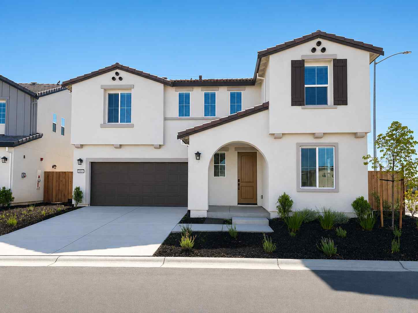 A white house with a driveway.