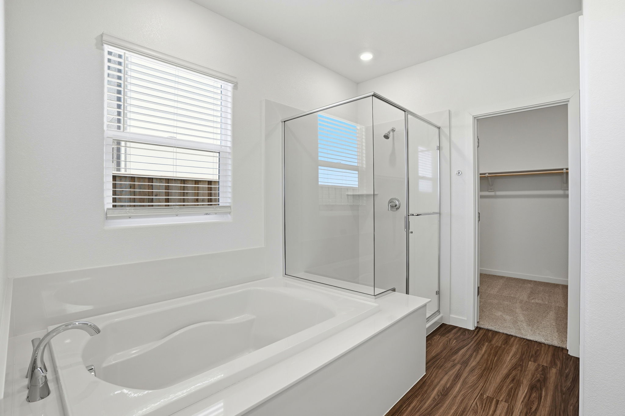 A bathroom with a tub and shower.