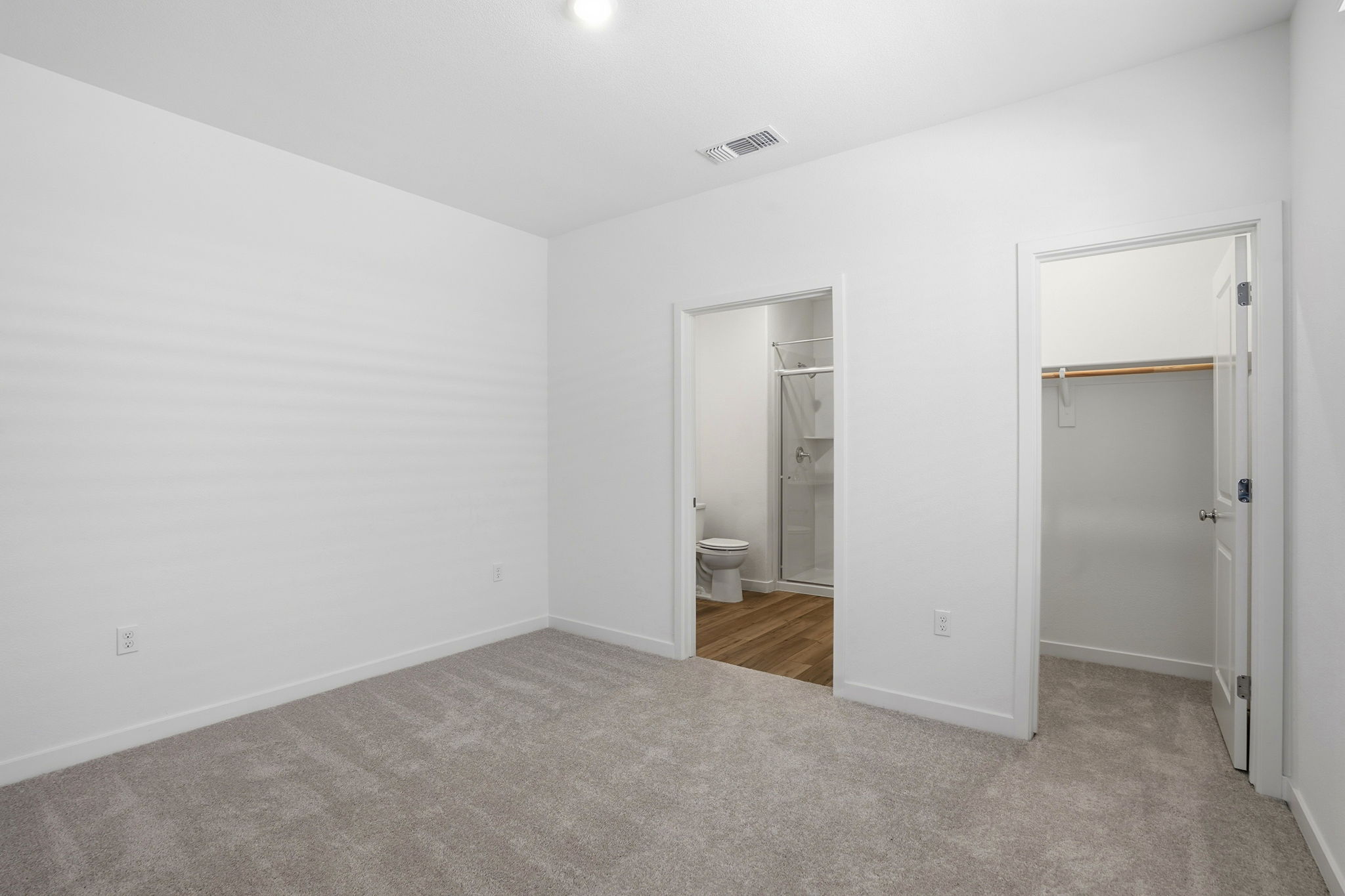 A bathroom with white walls.