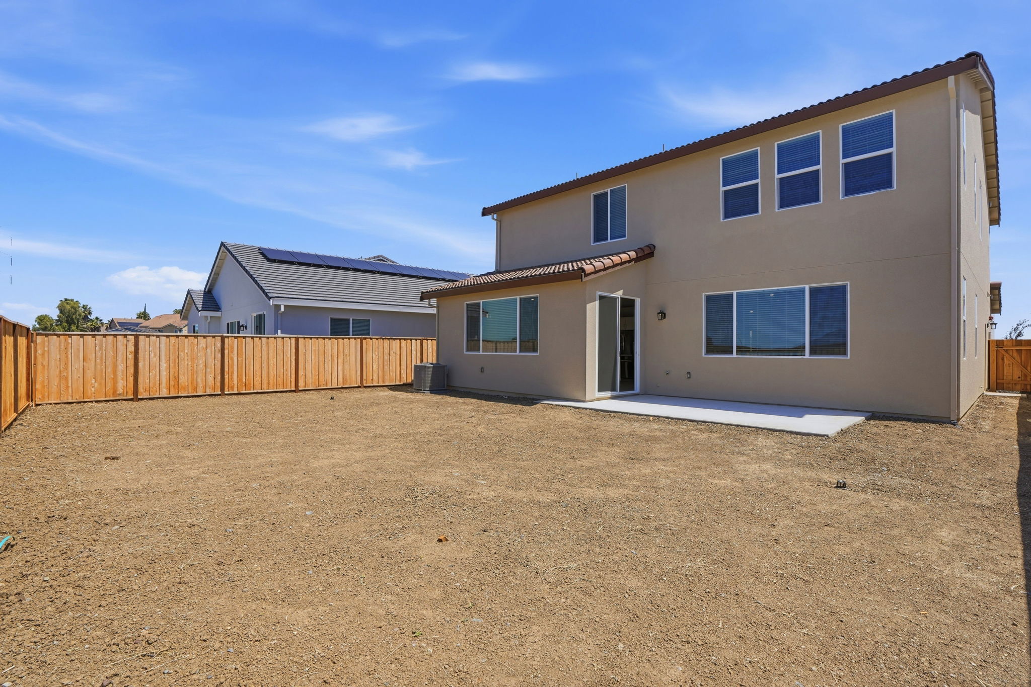 A house with a dirt yard.