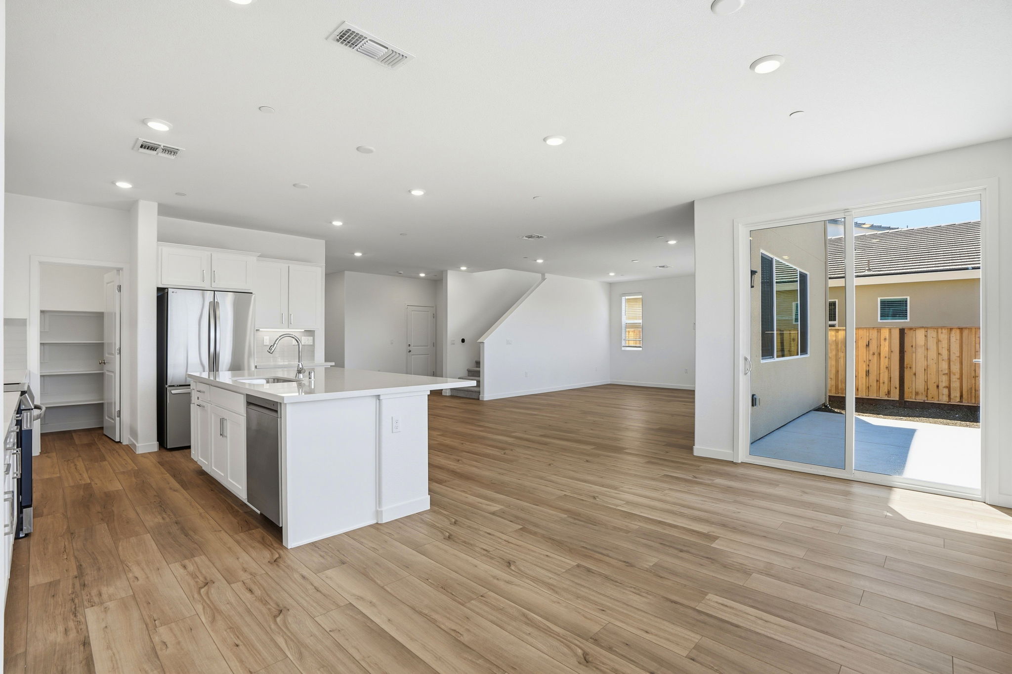 A large kitchen with white cabinets.