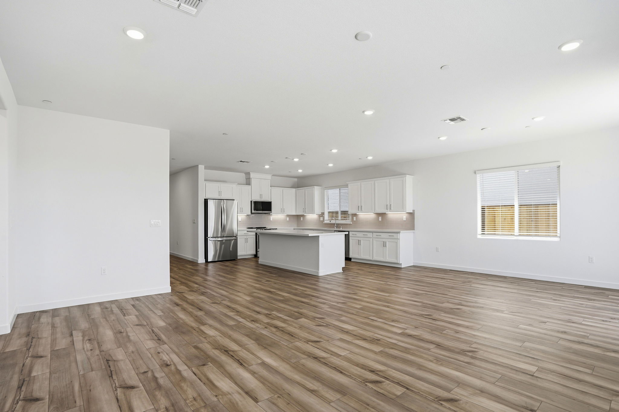 A large kitchen with white cabinets.