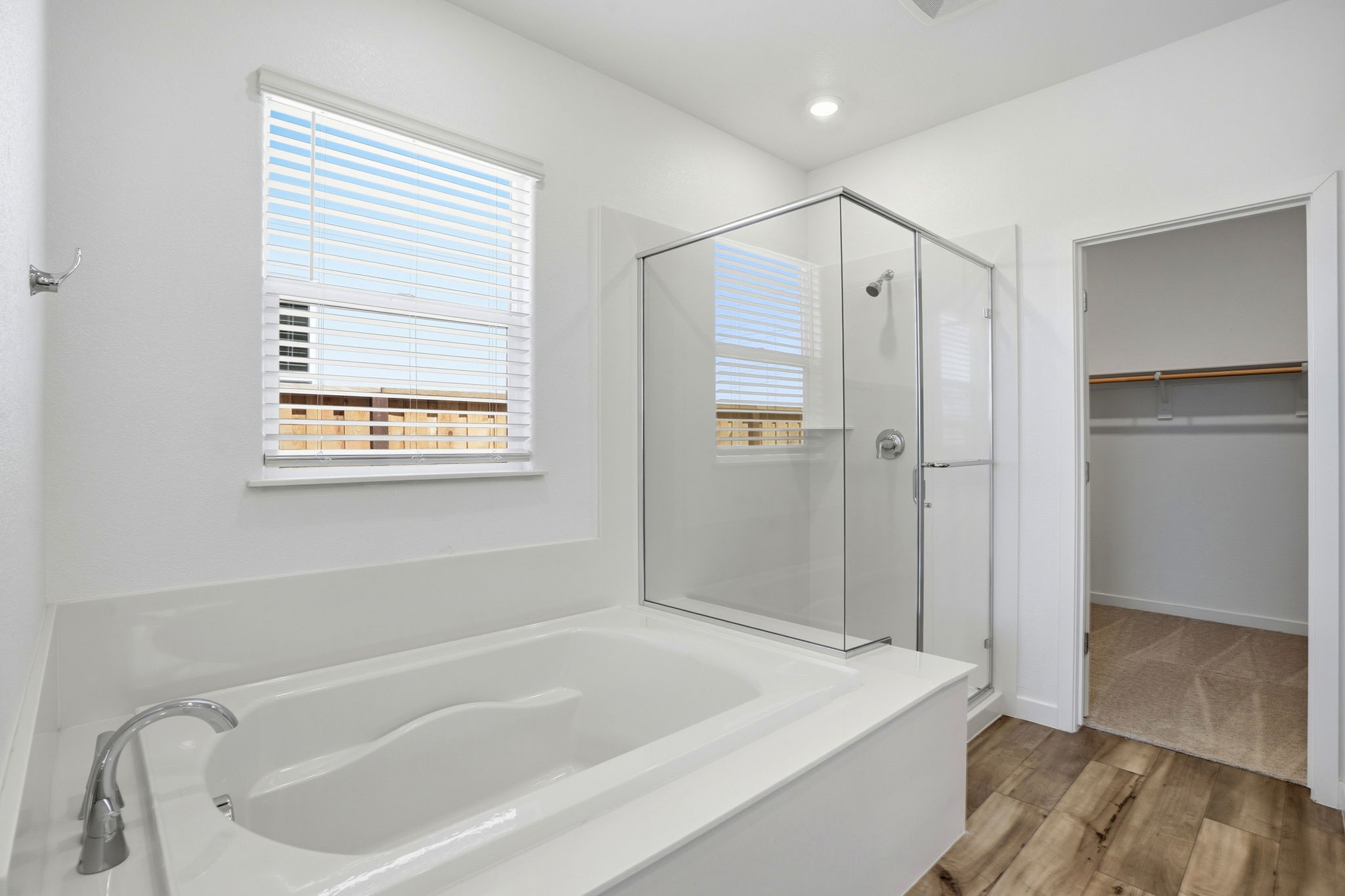 A bathroom with a tub and shower.