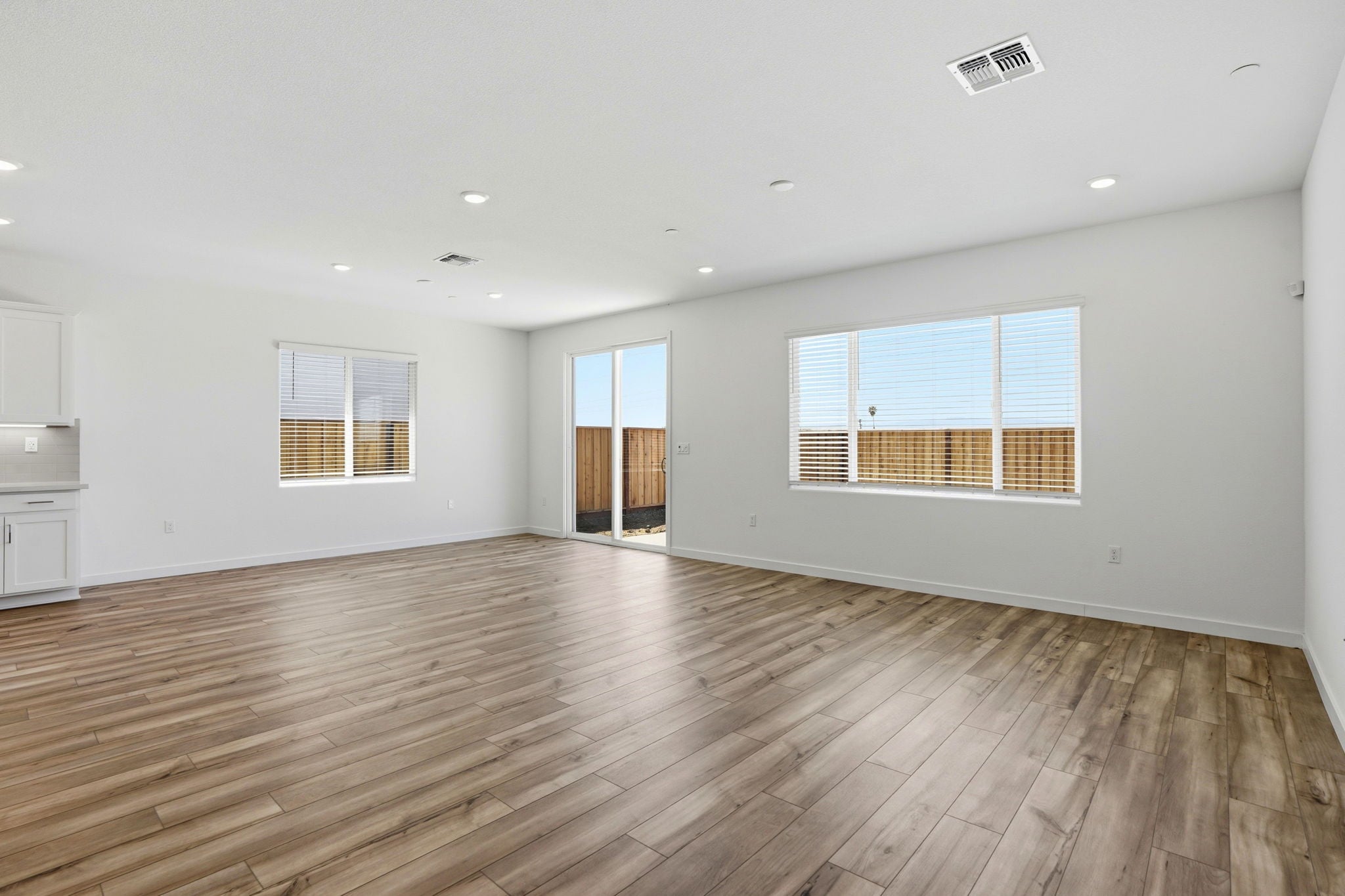 A room with a wood floor and a wood floor.
