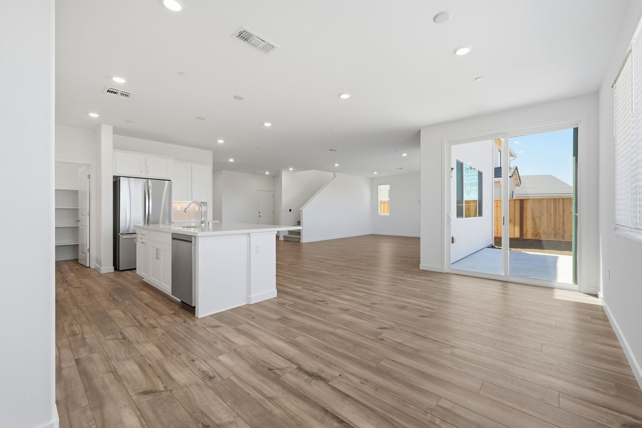 A large kitchen with white cabinets.