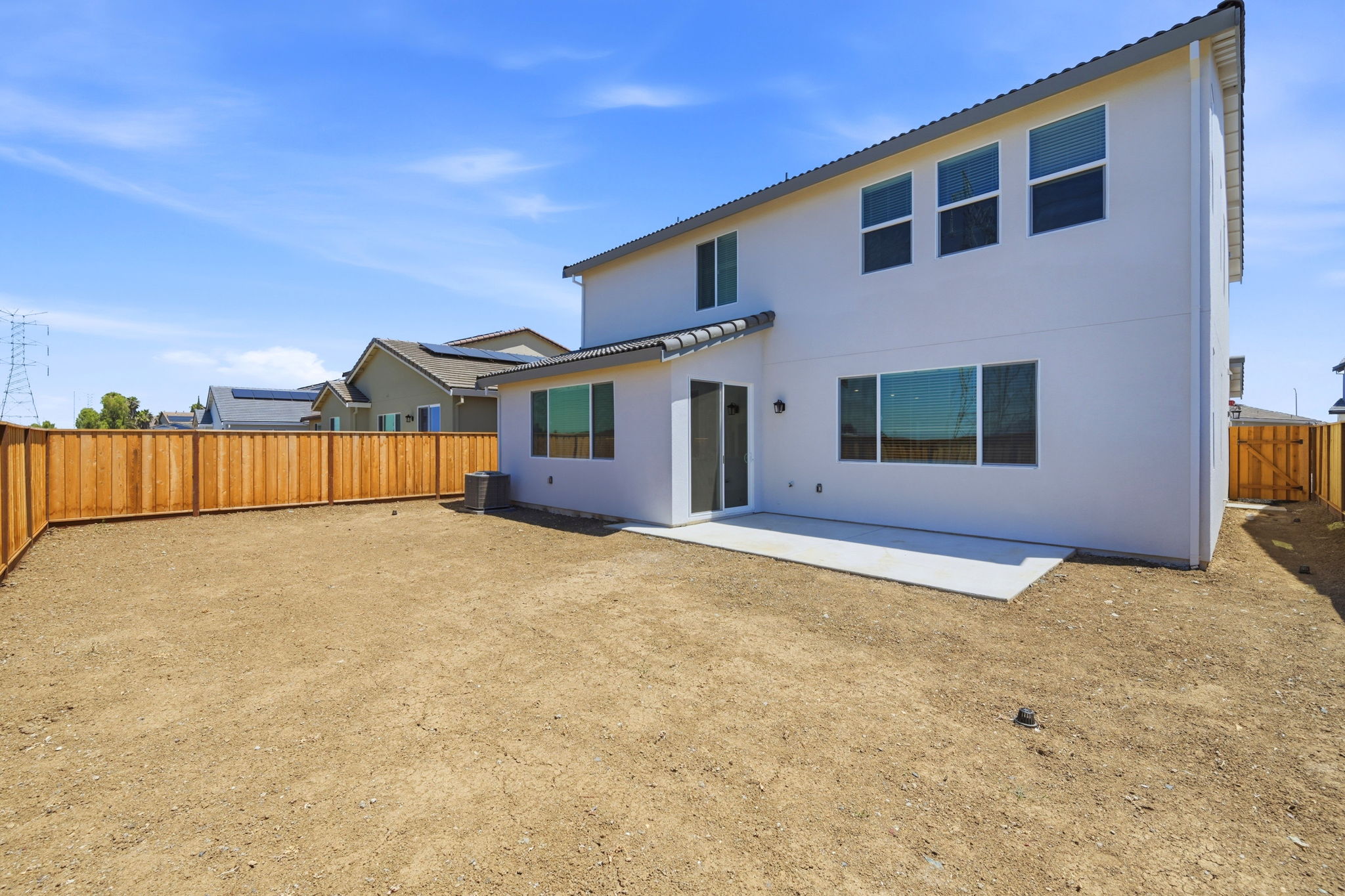 A house with a dirt yard.