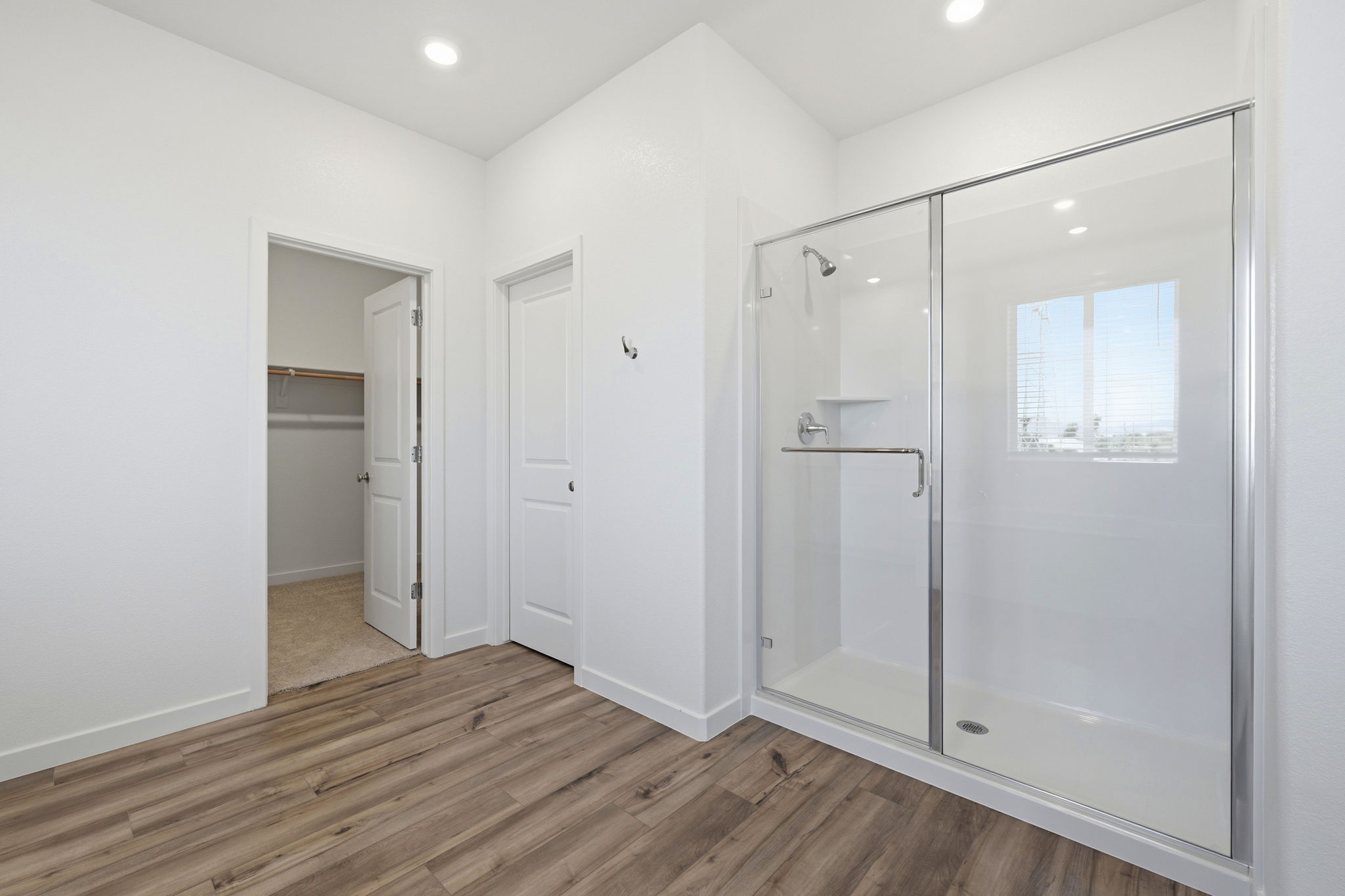 A bathroom with a glass shower.